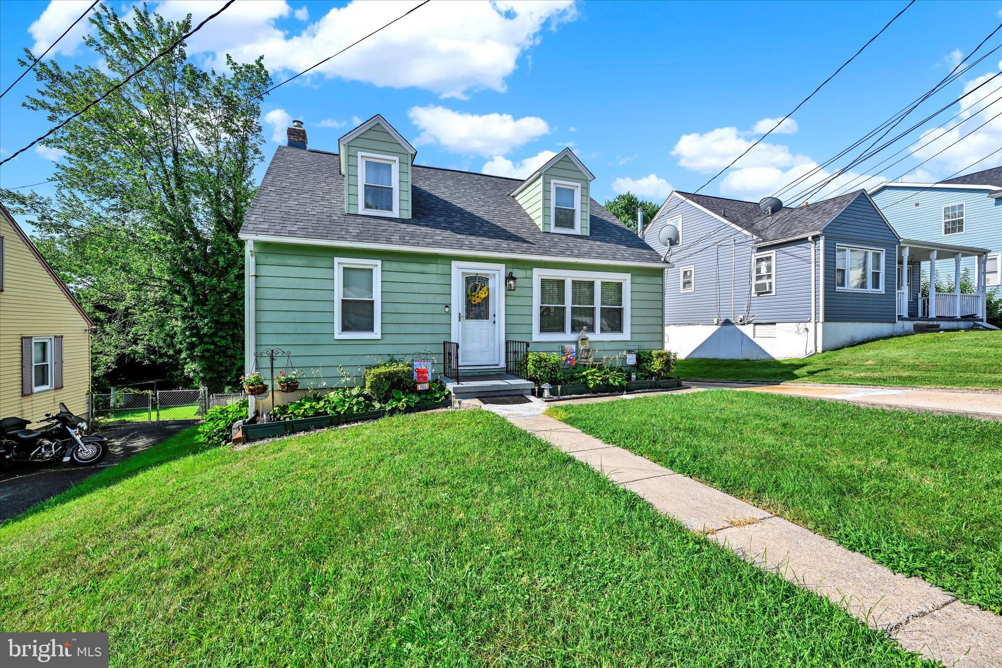 Welcome home to this sweet and well-kept Cape Cod! This 4-bedroom, 1.5-bath charmer has the space you need and the updates you want. Two bedrooms and a full bath are on the main level, perfect for easy living. The kitchen is ready for your next home-cooked meal with gas cooking, wall oven, and modern updates. Just off the kitchen, enjoy an enclosed porch that looks out over your big backyard, great for play, pets, or a garden. Upstairs you’ll find two more roomy bedrooms and a handy half bath. The full basement gives you plenty of storage and walks right out to the yard. Parking is easy too with a 3-car driveway. Big-ticket items? Taken care of! The roof is only 1 year old, the HVAC and water heater are just 3 years old. Move in with peace of mind. You’ll love how close you are to city employers, shopping, and dining, with quick access to 695 and 95 for an easy commute. Don’t miss this move-in ready gem. Come see it and fall in love!