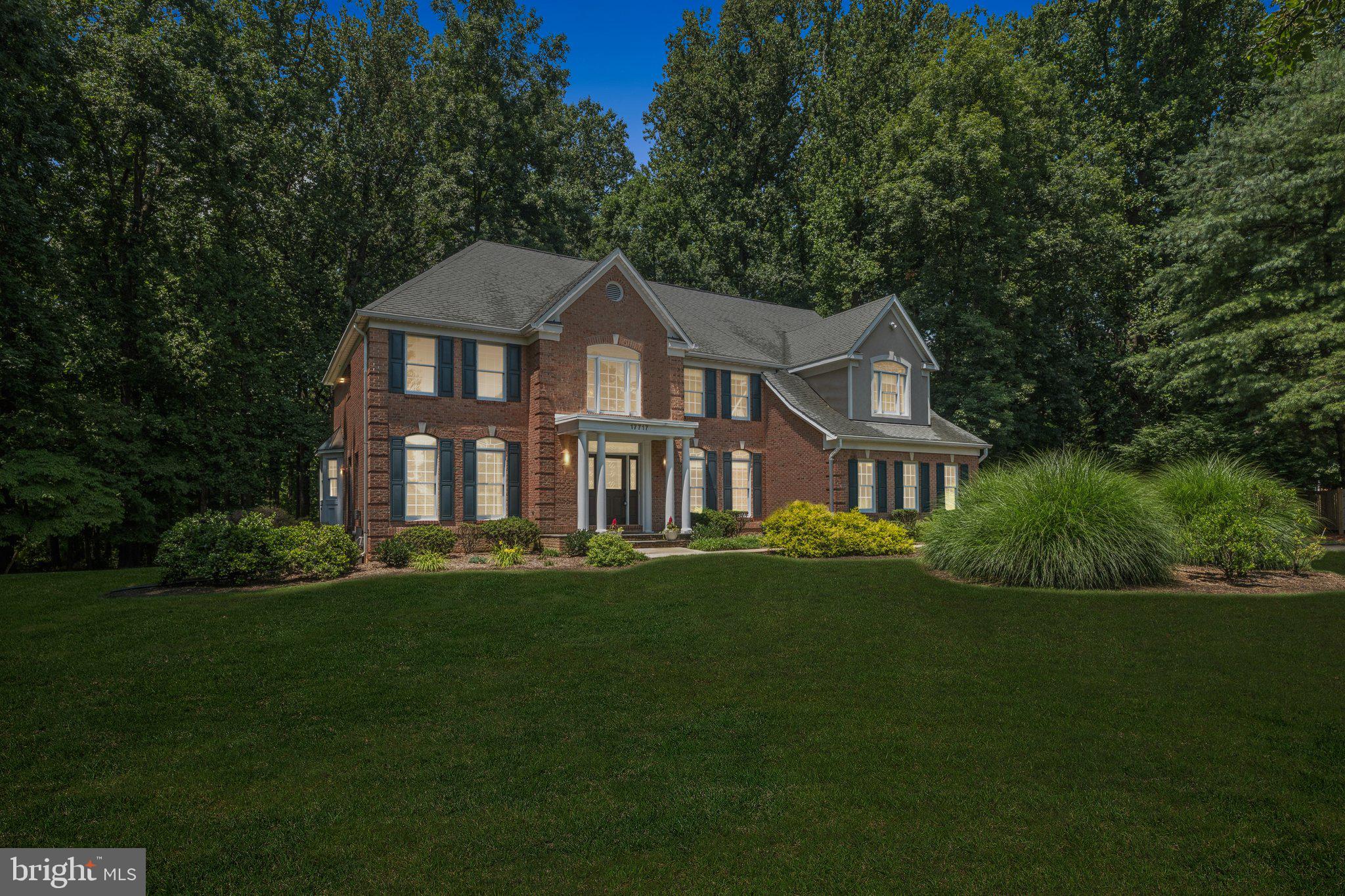 Welcome to this exquisite 5 Bedroom, 5 Full Bathroom Colonial nestled in one of Ashton’s most desirable neighborhoods. Situated on a beautifully maintained 2+ acre lot, this property offers a rare blend of privacy, luxury, and convenience. Step inside to discover gorgeous new flooring, fresh paint, and newly remodeled bathrooms that reflect modern elegance and timeless design. Soaring with natural light, the home is filled with walls of windows that perfectly frame the scenic surroundings. The incredible gourmet kitchen is an entertainer’s dream, complemented by three fireplaces, two wet bars, and an additional kitchenette—ideal for multigenerational living or hosting guests. The spacious sunroom invites you to unwind while enjoying peaceful views of the expansive grounds. Downstairs, a huge finished basement with bonus rooms offers endless potential for a home gym, theater, playroom, or private office space. A two-car garage adds practical convenience, and the layout is both thoughtful and functional. Located just minutes from popular restaurants, shops, and several beautiful parks, this home seamlessly combines tranquil living with accessibility. A rare Ashton gem—schedule your private tour today!