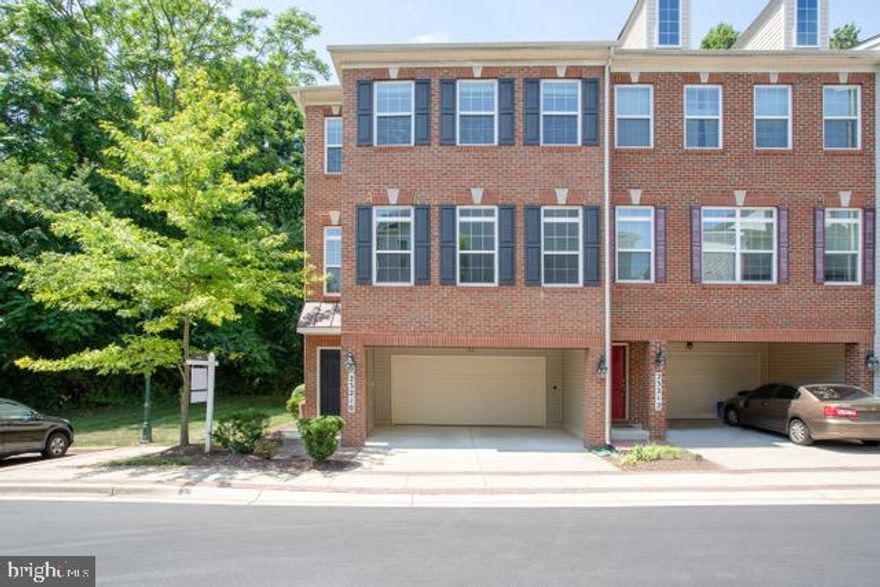 Absolutely stunning end unit brick 2 car garage townhome in sought after Gateway Commons***This beautiful home features wood floors in the main living areas, a gorgeous gourmet chefs kitchen with upgraded cabinetry and stainless steel appliances***The family off the kitchen includes a gas fireplace and leads out to a balcony overlooking trees for complete relaxation and privacy***The bedroom level showcases 3 bedrooms with an owners suite that includes 2 walk-in closets, vaulted ceilings and a wonderful owners bath with soaking tub and separate shower***This must see home also features a fully finished recreation room, 2 car garage and conveniently located just minutes to the Clarksburg outlets and I-270