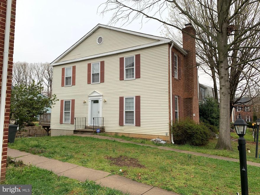 Great end unit townhouse with 3 bedrooms, 2 full and 2 half baths.  2 wood burning fireplaces. Kitchen has sliding glass door to large deck. Backyard is fully fenced.  Walkout basement has fireplace, and large utility room for workshop, tons of storage and laundry. Low HOA fees!