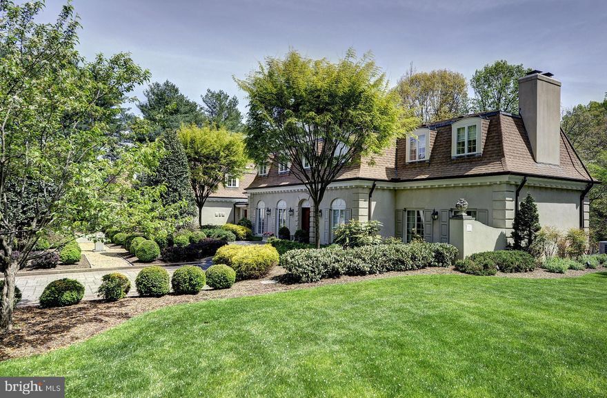 This European style villa is sited on 3 acres with a formal garden and an expansive terrace with water feature. With over 7,000 SF of living, this lovely residence has high-end appointments throughout including antique fireplace mantels, accent lighting and custom mouldings. The main wing has four bedrooms and there is a separate guest wing with two bedrooms each with a sitting room.