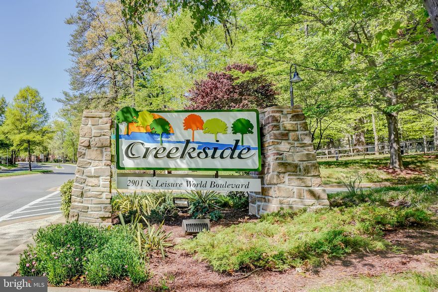 55+ Community of Leisure World !! Stunning freshly painted  condo "Q" model in newer building in Creekside, 2 bedrooms, 2 full baths, plus den/library with custom built -in wall unit and sunroom with walls of windows that bring the natural sunlight with treed view.  Elegant formal living room and spacious dining room with gleaming  brazilian wood floors. Separate large laundry room with storage. LR, kitchen and second bedroom open to the sunroom with peaceful view. Spacious table space kitchen with lot's of light, custom  built extra wall of cabinets, gas cooking and large window. Owner's suite has 2 walk-in closets and bedroom 2 is very spacious.  GARAGE parking # 9 extra large space  and storage bin room 5 bin 87 . Creekside has a guest suite you can rent for the night, remodeled party room, lobby and hallways.  Come live the leisure world lifestyle with tons of amenities and activities,18 hole golf course, tennis, pickle ball, state -of-the art fitness center, restaurants, indoor/outdoor pool, shuttle service, 2 clubhouses, medical center and the list goes on...