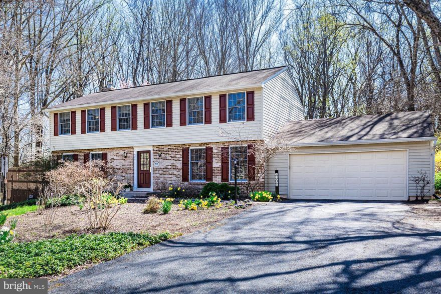 Live in your own parkland, not just near one.  The expansive yard has mature trees, extensive perennials, open grass for recreation and FOUR low-maintenace composite plank decks that overlook the Gwynn Acres Park!   This true 5 bedroom (on upper floor) has 2.5 bathrooms and many upgrades including but not limited to newer kitchen and baths, redone roof, hvac, hwt and gas fireplace.  This home provides an exceptional blend of style, comfort, and convenience. Main floor has formal dining and living, main floor laundry and family room with gas fireplace along with two new sliders to deck.  Kitchen has island, pantry, eat in b’fast room with built-ins, stainless appliances, quartz counters, farm style sink, and under cabinet lighting.  Upper level has two skylights (one in hall, the other in hall bath), 5 bedrooms with updated hall bath, linin storage and en-suite primary with dressing area, split vanity and updated bath.  Enjoy extra living space in the partially finished basement that has a walk-out to the side yard.   Home sits at the end of a shared driveway in a quiet cul-de-sac within a short distance to Centennial High, Burleigh Manor Middle, Centennial Lane Elementary and Centennial Park within a 5-minute walk.  Also nearby is the world class Miller Library, shopping, recreation, major roads with access to BWI, DC and Baltimore.  Be sure to review documents for a full list of upgrades.