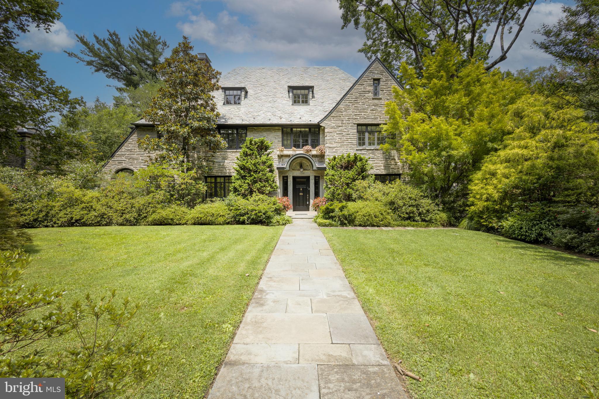 Elegant Stone Colonial Retreat in West Mount Airy
Welcome to 441 W Allen’s Lane — a magnificent stone center hall colonial nestled in the heart of West Mount Airy. This stately residence offers 6 spacious bedrooms, 3.5 bathrooms, and an expansive layout, perfectly blending timeless architectural elegance with modern comfort. Set on a beautifully landscaped lot, the home is surrounded by lush, mature gardens and features a private in-ground pool, perfect for summer relaxation and entertaining. A long private driveway leads to a built-in two-car garage, providing both convenience and privacy. Inside, the classic center hall floor plan offers graceful flow between rooms, with abundant natural light, hardwood floors, and original architectural details throughout. The first floor includes a grand formal living room with a fireplace, a formal dining room, a large eat-in kitchen, and a cozy family room or sunroom — ideal for gatherings and quiet evenings alike. Upstairs, the primary suite is a peaceful retreat with an en-suite bath , an arched separate seating area, a fabulous dressing room, walk-in closet, and more. The additional 5 bedrooms are generously sized and flexible in function, easily accommodating home offices, guest rooms, or creative spaces. Located just steps from the trails of the Wissahickon Valley and within walking distance to the shops, cafes, and train stations of Mt. Airy and Chestnut Hill, this extraordinary home offers the rare combination of privacy, space, and accessibility in one of Philadelphia’s most desirable neighborhoods.