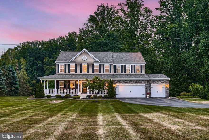 Exquisite 4BR/3.5BA expansive Colonial on a sprawling lot in Forest Hill. Park in front of a three-car garage, make your way past beautiful landscaping, and step up onto the wrap around porch of your forever home.  Step into a bright airy interior featuring luxury vinyl flooring throughout and an entry offering a view of the second floor landing.  On either side of the entry, columns flank the openings into a formal dining room featuring chair railings, and a home office with custom built-in cabinetry and shelving.  Step through into a large family room boasting a gas fireplace with a stone hearth and wood mantel. Move through into the amazing open concept kitchen and breakfast room.  The kitchen offers plenty of cabinets, a separate pantry closet, stainless steel appliances, granite countertops with a complimenting backsplash, a center island, and a peninsula that overlooks the breakfast room with a stainless sink and seating. Just past the kitchen is a half bath, laundry room, and access to the garages.  The open staircase leads to a grand primary suite with a vaulted ceiling, walk-in closet, and ensuite with a double sink vanity, soaking tub, and walk-in shower.  Three spacious bedrooms and a full bath with a double sink vanity completes this floor.  The lower level offers additional living space featuring a child's playroom with custom cabinetry and barn doors, a den with built-in shelving, shiplap wall designs, an area for a gym/gaming, a full bath with walk-in shower, and a walk out to the amazing yard.  From the breakfast room, french doors open to an oversized Trex deck with steps to a paved patio featuring a stone wall, all overlooking an abundance of green space in the tree-lined yard. A firepit area ideal for gathering with friends and family, a playground area, and shed completes the yard space.  This home is move-in ready with dual zone heating and air and solar panels that are fully paid off and so much to offer new homeowners.  Imagine all this and in close proximity to shopping, restaurants, and commuter routes.