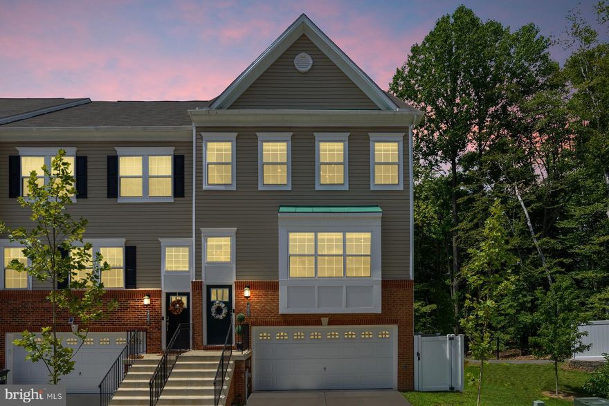 You do NOT want to miss this one of a kind uniquely elegant home that you can easily call yours!!!   This is the ULTIMATE townhome that is truly ONE OF A KIND!!! It is a fully custom and beautiful designer home from the gorgeous 4th level loft/bedroom all the way down to the spacious basement! When I say this townhome is one of a kind, it is because no other townhome on this lot even comes close to this end home!   Beautifully well-maintained laminate floors throughout the home with the exception of the stairs, which has plush grey carpet to match the laminate and the bathroom floors, which have gorgeous ceramic tile! Everything in this stunning home was completely handpicked & custom designed from the floors to the multiple spacious closets throughout, to the walk-in fully customized chef pantry, to the double wall oven in the kitchen, to the elegant pearl white extra wide granite tops and the massive island in the kitchen, to the luxurious walk-in custom designer master closet, to the spacious basement that has a full bathroom & could easily be used as an additional 5th bedroom!   Not to mention the stunning backyard nestles up to breathtaking woods. This backyard has its own charm with a beautiful tall white vinyl fence that has two locking gates. One gate leads to the pathways in behind the house and the other gate will take you to the side yard. This maintenance-free backyard comes with custom pavers and a side yard that has artificial grass, which you and your pet will love. It makes it for an easy clean up! The deck has been extended as it was  custom built and it is the only townhome in the area that has stairs leading down to the backyard, perfect for entertaining! Just a very short easy walk away to two major shopping centers! Grocery stores, numerous delicious restaurants, department stores, doctor offices, movie theater plus much much more! Close to Fort Meade & major highways!!!  Come check this out today before it quickly goes off the market! Come make this townhouse your home sweet home!