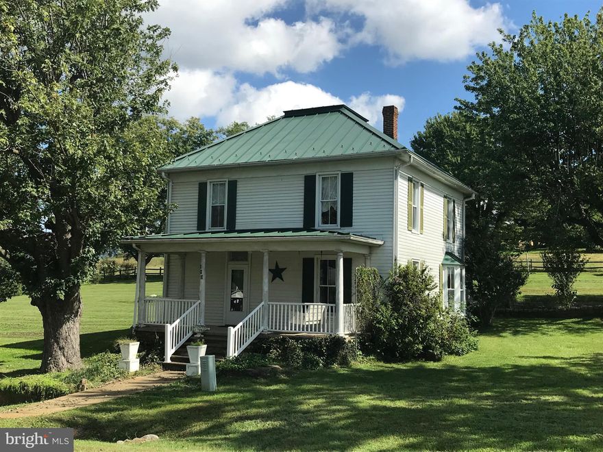 Beautiful 3 bedroom & 2.5 bathroom home on approx.1 acre of land, with 1 car detached garage and out building. Beautiful hardwood floors and cedar closet. Gorgeous wood staircase, Tap fee has been paid to hook up to public sewer if desired. Lifetime warranty on metal roof. Replacement windows, Gas fire[place, 9'ceilings on main floor, Large yard with mature trees, and VIEWS!  VIEWS! VIEWS!!