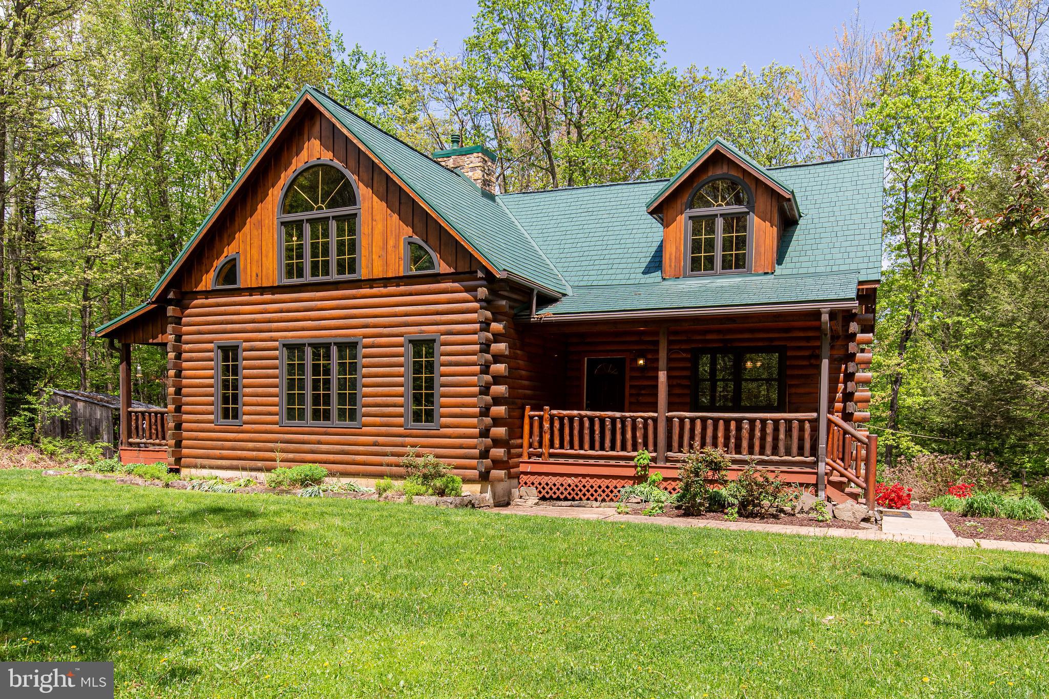Nestled in a serene, wooded setting, this beautifully crafted log cabin-style home offers the perfect blend of rustic charm and modern comfort. Situated on 4.07 acres of private land, the property provides a peaceful escape with plenty of space to roam, garden, or simply enjoy the outdoors.
Inside, the home features 3 bedrooms and 2.5 bathrooms, including a spacious first-floor primary suite for convenient single-level living. The heart of the home is a stunning vaulted-ceiling living room with exposed beams, abundant natural light, and a cozy fireplace—a perfect gathering place for all seasons.
The open loft area overlooks the living space below, offering flexibility for an office, reading nook, or guest space. The walkout lower level is already plumbed for a bathroom and provides ample potential for finishing to suit your needs, whether it be additional living space, a recreation room, or a home gym.
Enjoy the outdoors from multiple vantage points, including a large deck, two covered porches, and an expansive yard that invites outdoor living. The home also includes central air conditioning for year-round comfort and a second fireplace for added warmth and ambiance.
A large shed provides excellent storage for tools, equipment, or outdoor toys, making this property as functional as it is beautiful.
Whether you're looking for a full-time residence or a private weekend retreat, this log cabin offers the tranquility and space you've been dreaming of—all just a short drive from town amenities.