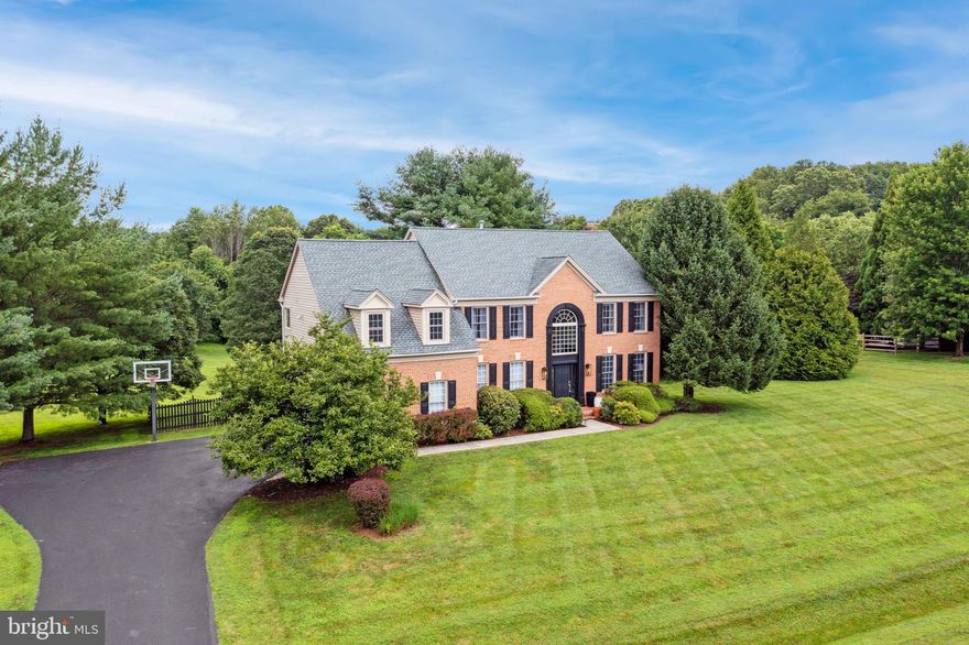 Welcome to 14213 Cervantes Avenue—a handsome brick-front colonial offering 5 bedrooms, 3.5 baths, and an impressive 5,190 square feet of beautifully finished living space across three levels. Set on a large, flat lot with professionally upgraded landscaping, this home combines classic charm with modern comforts with a contemporary style and flair, in one of Darnestown's most desirable neighborhoods.

Step inside to discover an expansive, fully renovated kitchen featuring a large center island, gas cooking, and abundant cabinet and counter space—perfect for entertaining or daily life. The main level also includes a formal living room, a formal dining room, and an oversized family room with a cozy wood-burning fireplace and French door opening to a deck that spans the entire rear of the home, offering serene views of the sprawling backyard.

Upstairs, the enormous owner’s suite includes a luxurious sitting room, a massive walk-in closet, and a spa-like ensuite bath complete with a soaking tub, separate shower, and dual vanity. Three additional generously sized bedrooms and a full bath complete the upper level.

The fully finished, walkout lower level adds incredible versatility with a large recreation room, a dedicated gym or bonus room, a fifth bedroom or home office, and a full bath. French doors lead to a covered flagstone patio—ideal for relaxing in the shade or hosting outdoor gatherings.

Additional features include a whole house gas generator, 2-car garage, gas heating, recently finished hardwood floors, upgraded lighting throughout, ample off-street parking, and private, mature landscaping. Enjoy easy access to local parks, trails, and nearby shopping and dining options, all while nestled in a peaceful, well-established community.

Don't miss this exceptional opportunity to own a spacious, updated home in an unbeatable Darnestown location minutes from Harris Teeter, the Darnestown Swim and Racquet Club, The South Germantown Recreation Park, Darnestown Road, and River Road.

Professional photos coming tomorrow.