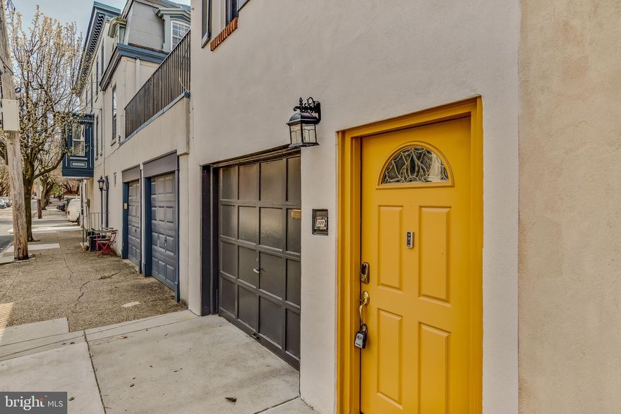 In a neighborhood defined by history, this residence stands as a modern marvel of convenience
and light. Located in the heart of the Spring Garden Historic District on a quiet tree lined block,
this home offers the one thing most city dwellers only dream of: a one car attached garage with
direct interior access.  On the lower level, a flexible, private suite with a full bathroom is perfect for multi generational  living,  a sophisticated guest wing,  a quiet home office or a fantastic family room.
Transition from the interior lower level to a large, tranquil patio. This private outdoor sanctuary is
perfect for fresco dining, container gardening or an evening of relaxation under the stars.
The second level features a sweeping open-concept floor plan designed for the modern lifestyle.
The gourmet kitchen is a focal point, anchored by stainless steel appliances, generous wood
cabinetry and an enormous walk in pantry that provides unparalleled storage. Whether you’re
hosting a formal dinner in a transitionless dining area or relaxing in the expansive living room,
the flow is effortless and inviting. Off of the dining room is an attractive deck with access to the
patio below.  As you move through the home, look up-a stunning skylight sits atop the staircase, flooding the
center of the home with natural light.  The upper level features two spacious bedrooms, a hallway bathroom, a dedicated laundry room positioned to make daily chores a breeze and the master bedroom and primary bathroom.  This home is conveniently located to public transportation, the Museum District, local shops and
restaurants, major highways, hospitals and universities.  Don’t miss this exceptional opportunity to live in one of the best neighborhoods in the city.