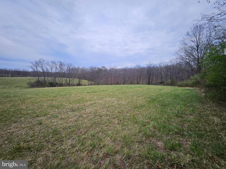 5 Acre building lot Northeast of Winchester, Va.  the Clearbrook / Brucetown area.  Nice open space for a home as well as wooded in the rear, The lot is located on Hard surface Rocky Ford Road State maintained.   Approved 4 bedroom Septic. Water - Well.  Restrictions will be recorded  with deed on lot.