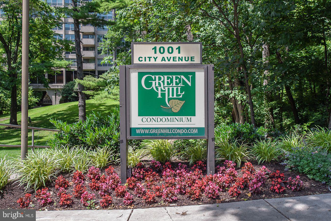 Welcome to the Community of Green Hill, where this condo with its breathtaking treetop views and abundance of natural light awaits you! This bright and sunny unit offers an open floor plan with 2 Bedrooms and 2 Baths. Galley Kitchen (2019) features electric cooking, built-in microwave, new garbage disposal (2025), granite counters, great cabinet space for your food storage, cooking equipment, silverware and dishes! Spacious Living Room and Dining Area with sliding doors to the balcony provide the perfect space for entertainment. The Main Bedroom w/ceiling fan is generously sized with three closets and a Main Bath (2019). The second Bedroom/Den w/ceiling fan and walk-in closet. Additional highlights of this unit include a second Bathroom, walk-in hall closet, in-unit full size washer and dryer, storage unit, ensuring ample convenience for all your needs. With 1,222 sq. ft. of living space this unit has a new electric panel (5/2025), new window treatments in Bedroom and Den 5/2023, living room carpets new in 2025 and bedroom, kitchen and living room painted in 2025. The Green Hill offers a multitude of amenities for its residents. Enjoy the peace of mind provided by the 24-hour Gated Community, 24/7 Security, Doorman, Library, Meeting Rooms, Elevators, Courtesy Bus, Playground area, Tennis Courts & much more! The courtesy bus goes to area shops, train stations, Lankenau Hospital, etc. There is a Health Club, Indoor and Outdoor Pool available for an additional fee!