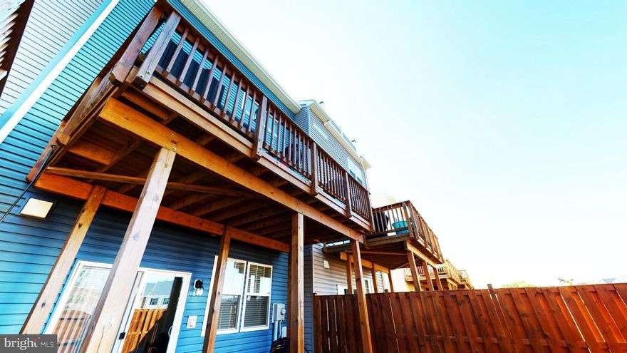 Welcome to this sun-drenched almost new brick front home built for entertaining! Just over 2300 square feet of finished living space and a 2 car garage. Beautiful hardwood floors run throughout the main level living room, dining room and kitchen.  The gourmet kitchen features granite counters, kitchen island, upgraded stainless appliances including a French door refrigerator, upgraded 42" cabinets. The kitchen sliding glass door leads to a large oversized composite deck! The community offers a pool, fitness center, club house and tot lot. This home is conveniently located near shopping, restaurants and commuter routes. There's nothing to do, but move in!