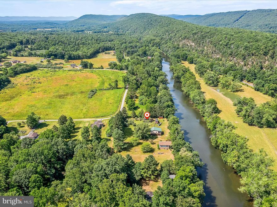 Price reduced! Tiny Home included!  Serene Riverside Retreat: Your Dream Awaits! 
Nestled within walking distance to Capon Bridge, right along the deeper part of the tranquil Cacapon River, this enchanting piece of land offers a unique blend of comfort and nature. Spanning a little over half an acre with 100 feet of pristine riverfront, this property is the perfect escape from the hustle and bustle of city life. This property already has a shared well and septic and waiting for you to bring your dream to life. 
Connectivity: Great internet options available, perfect for those who need to stay connected while enjoying the serene surroundings.
Outdoor Paradise:
 The property is home to the famous Capon Bridge Eagles, often seen perching across the river, along with an abundance of other wildlife. Take the steps down to the river and cool off in its refreshing waters, or simply relax and soak in the scenic beauty.
This riverside retreat is the escape you have been waiting for. Whether you're seeking a weekend getaway or a permanent residence surrounded by nature's splendor, this property offers it all. Don't miss your chance to own a piece of paradise!
Schedule a Visit Today!
Experience the magic of  the breathtaking beauty of the Cacapon River. Your dream riverside living awaits!
