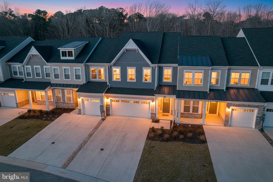 Welcome to Milos Haven!  This beautifully appointed turn-key townhouse is tucked away in a private, wooded setting. Backing to mature trees, this fully furnished and tastefully decorated coastal retreat is move-in ready and waiting to be enjoyed.  A welcoming entry foyer opens to a bright chef’s kitchen featuring white quartz countertops, crisp white cabinetry, a white tile backsplash, a large center island, and stainless-steel appliances including a gas cooktop. Luxury vinyl plank flooring begins in the foyer and extends throughout the open-concept main living area, seamlessly connecting the kitchen, dining area, and great room.  The great room is highlighted by vaulted ceilings and flows effortlessly to the newly added sunroom and paver patio through sliding glass doors—both overlooking the serene, private backyard surrounded by trees.  The main level also offers a spacious owner’s suite with tray ceiling and custom plantation shutters, an en-suite bath with tiled shower, double vanity with granite countertops, and a walk-in closet. Completing this level are a powder room, laundry room, and a two-car garage with epoxy-coated floors.  Upstairs, you’ll find a versatile loft family room, a second en-suite bedroom with tiled shower, and two additional bedrooms that share a hallway bath with a tub and tile surround.
The community features a swimming pool and bathhouse, along with low townhome and HOA fees. Surrounded by natural woodlands, Milos Haven offers a peaceful, private setting while remaining just minutes from Fenwick and Bethany beaches, shopping, dining, and local attractions. With premium finishes, a wooded backdrop, and true turn-key convenience, this townhome perfectly captures the relaxed coastal lifestyle.  Start enjoying beach life today or reap the rental rewards from a short-term or long-term rental!  Rental Proforma available with potential to earn $25,700 to $63,500 per year!  Take the video tour!