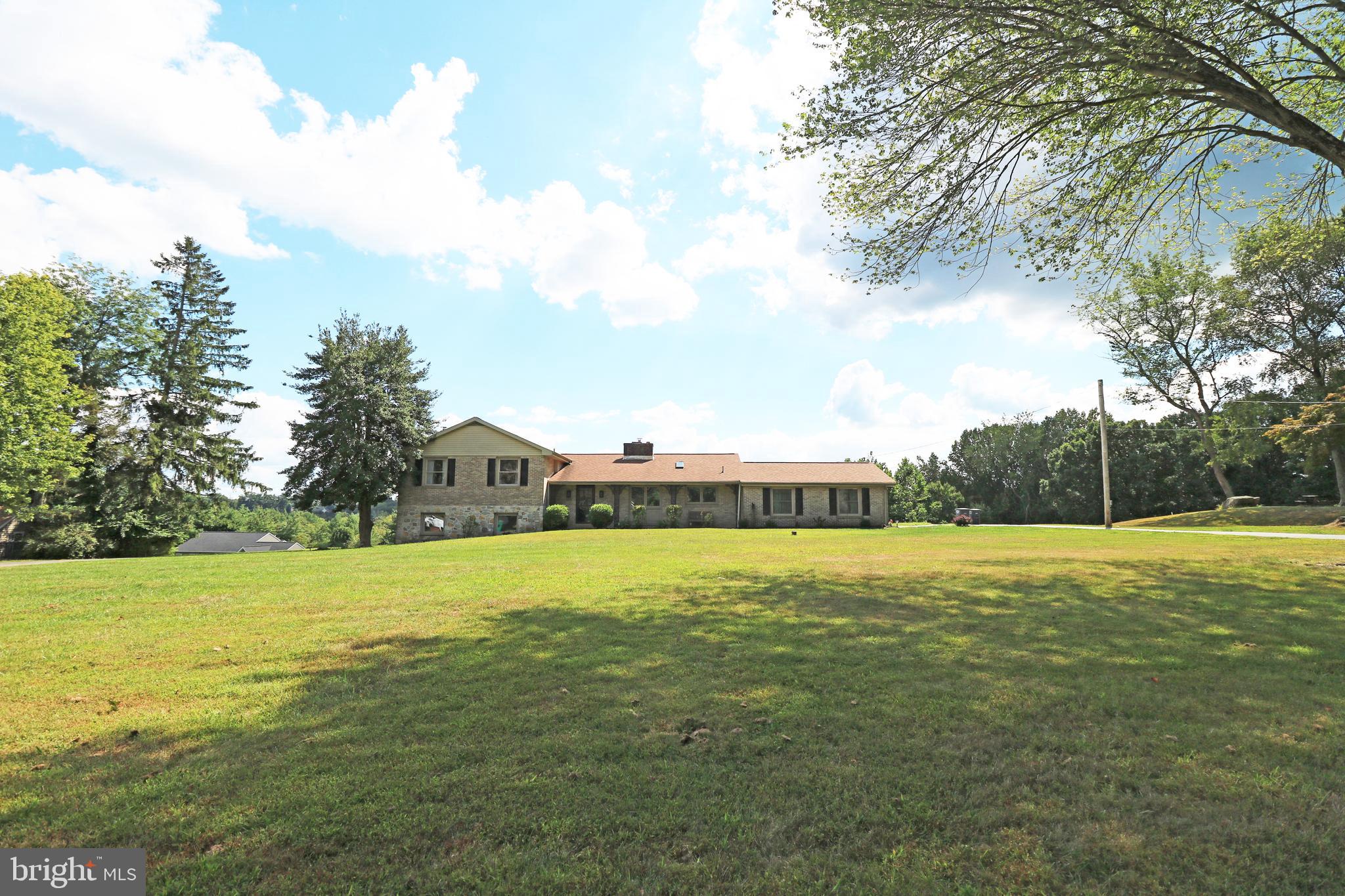 Simply BREATHTAKING views from a lovely 1.6 acre lot with an in-ground pool! This treasure sits on a cul-de-sac with lots of space between homes, but still offers a neighborhood feel! This home provides comfort, beauty, and privacy. The brick and stone split level/colonial home has been proudly cared for by ONLY two families. You can be the third to experience home on this incredibly magnificent piece of real estate in the award winning school district of Garnet Valley!
Built of all plastered walls and masonry, each brick and stone was carefully selected by the original owner. The home boasts 3 fireplaces; one in the kitchen that can double as a brick oven for the family's pizza night, another in the living room, & the third is in the family room of lower level. The entire layout is well-designed and convenient for all. Spend time on your front porch relaxing as you sip your coffee or tea. Enter the home and you're greeted by a large eat-in-kitchen area with a fireplace and new luxury vinyl flooring throughout. The living room boasts a large window which serves as a gorgeous back drop of the pool and view! The formal dining room has a separate entrance that leads to the back patio, where BBQing and roasting marshmallows are just the beginning of the possibilities of fun and night swimming!
A new garage door motor (2025) has been installed and the attached 2 car garage has a convenient entrance into the home’s kitchen.
For game day or movie night, venture to the large lower level family room with recessed lighting and a fireplace. Tons of natural light through the large windows! The lower level also has a full bathroom, a formal laundry room, and the 4th bedroom that offers cedar closet and double doors that lead to the side yard! The lower-level family room and bedroom were updated in 2025. This lower level also provides an opportunity for an in-laws or au pair / nanny suite. The basement (840 sq ft) has plenty of room for storage and utilities.
The upper level offers three bedrooms, a primary ensuite bathroom, and a hall bathroom (updated 2025). The large primary bedroom and ensuite bathroom were painted and updated in 2025. The 2nd and 3rd bedrooms finish the upper level of this home.
Original hardwood floors cover the upper level, luxury plank vinyl cover the main and lower levels (2025). Freshly painted throughout (2025). New shingle roof (2021). HVAC serviced routinely. Chimney cleaned routinely. Septic emptied (8/2025) by Eldredge Septic Management and went through checklist.