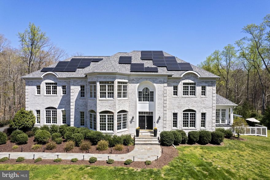 Elegantly renovated in 2017, this private 5-acre estate in historic Clifton, VA welcomes you. Enter to a grand curved staircase and a breathtaking 22 ft two-story foyer.  Navigate 3 of the 4 levels with ease in a private elevator:  MAIN LEVEL - Great Room with floor to (22 ft) ceiling windows, spacious Kitchen area with a Breakfast Area with a wall of windows, relaxing Sunroom, banquet size Dining, generous Living Room, and Home Office.; UPPER LEVEL 1 - 4 en-suite Bedrooms; UPPER LEVEL  2 -2 additional Bedrooms and 1 Full Bath; LOWER LEVEL is an incredible Walk-Out living space, offering everything you would want - a Home Theater, Recreation Area, Game Room, and Bar.  Large Flex Room with Bathroom functions perfectly as Guest Quarters.  The bar opens to the OUTDOOR POOL/SPA RETREAT made complete with multiple seating areas, a gas firepit, heated saltwater Pool, bromine hot tub, and multi-colored lighting system.  All of this amid breathtaking view of the sprawling backyard, cloistered in mature trees. This home offers GREEN TECNOLOGY in a Solar Roof. and Surge Protection in entire home. Your new paradise is only a couple of miles to charming restaurants, ice cream, wine tasting and more, on Main Street and the Clifton Historic District, and hiking trails and very close to schools.