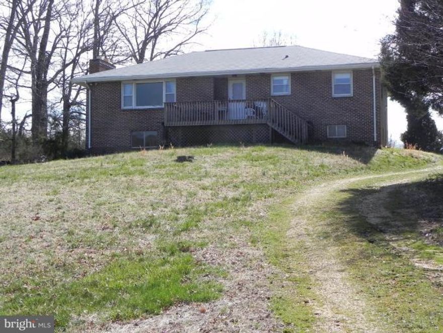 Working Hay farm 54 acres of mostly cleared land appx 14 acres wooded, with a 3 bedroom 2 bath brick home with full basement. Large Metal building with run in shed attached. Amish Shed approx 30X12. Older Gazeebo and barn behind house. Home needs some updating but livable. Two parcels24 & 30 acres. No covenants, no easements. Great for large horse farm or growing crops. Deer and turkeys everywhere