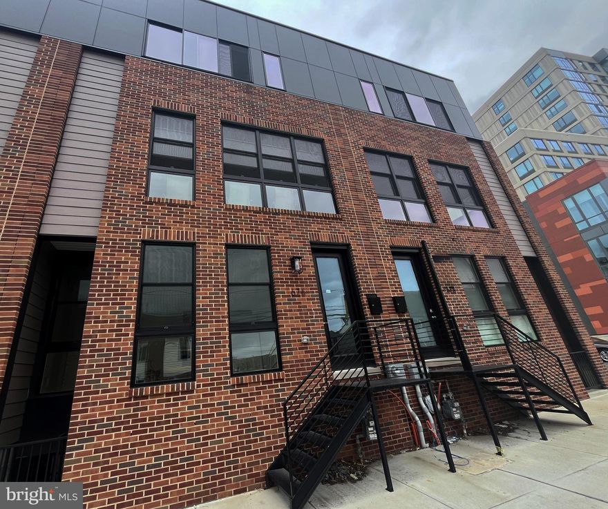 Welcome to this stunning end-unit townhome, newly constructed in 2024 and located in the highly desirable Spring Garden/Poplar neighborhood of Philadelphia. Offering approximately 2,540 square feet of stylish living space (per public records), this home perfectly blends modern design with everyday functionality. The first floor features an open-concept layout, seamlessly connecting the spacious living room, dining area, and gourmet kitchen—ideal for entertaining or relaxing with family and friends. Upstairs, you’ll find three generously sized bedrooms, each with ample closet space, and three full modern bathrooms. A fully finished basement provides additional flexible living space—perfect for a home office, gym, or media room. Additional highlights include: Covered driveway parking, Rear deck—ideal for unwinding after a long day. Prime location, just minutes from major roadways, public transportation, and local shopping and dining options. Don’t miss this golden opportunity to own a beautiful, move-in ready home in one of Philadelphia’s most vibrant communities. Schedule your private showing today!