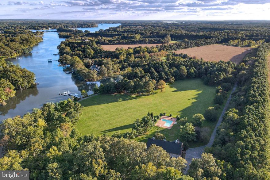 "Wakefield Farm", a unique almost 80-acre waterfront property centrally located just minutes to Easton & St. Michaels.  The property itself is a rare opportunity for any discerning buyer, with over 750' of water frontage on Dixon Creek feeding into the Tred Avon.  This exceptional lodge-style home has been meticulously updated throughout and it is ideal for informal living or large gatherings.  The main residence is highlighted by the great room with soaring ceilings and 2 large bay doors that open and are ideal for entertaining.  Additional features include a gourmet kitchen with butler's pantry, adjoining family room w/ fireplace, grand family room on second level with full bar, den, a large master bedroom with ensuite bathroom & walk-in closet with custom built-ins, and 5 additional bedrooms & bathrooms.   This stunning property is an ideal retreat offering endless possibilities; including large inground pool with brick patio, hunting, freshwater fishing in private freshwater pond, two large farm fields that can be converted for sporting activities, and large private dock with multiple slips for power boats, jet skis, kayaks, fishing, etc.  A paved and lighted trail meanders from the residence, to the waterfront, and throughout the property; perfect for walks, runs, or biking.  The entire property recently has the amperage increased to 800 amps, allowing for additional structures.   This exceptional offering is completed by a 3-bay outbuilding and an oversized detached garage measuring 50' x 100' ideal for cars, boats, and storage.   Truly a must see.