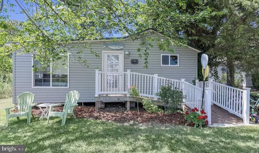 Welcome to your cozy little island cottage! This two bedroom, one bath, fully renovated bungalow is move-in ready and easily accessible. Tucked away at the end of the street on a quiet corner lot, the property is surrounded by beautiful shrubbery and shady trees. Featuring an open concept design and wood flooring throughout, this gem of a home is tastefully decorated with many desirable features. Each room has pocket doors and there’s an inviting feel to the space. All appliances and most furnishings are included in the sale. Comfy, cozy, clean, neat and tidy best describe it. Come check out this storybook listing on Smith Island, Maryland.