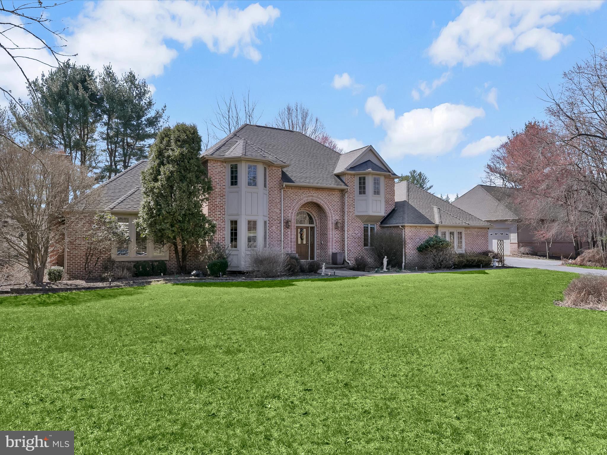 Introducing an exquisite residence boasting four bedrooms with four-full and one-half bathrooms across three levels of thoughtfully designed living space. Nestled on a 3.39-acre lot at the end of a quiet cul-de-sac, this property offers both privacy and convenience, complemented by a versatile detached garage. A grand two-story foyer welcomes guests with timeless accent trim moldings, including chair railing, crown molding, and wainscoting. Elegant and inviting, the formal dining room provides an ideal setting for hosting, with French doors leading seamlessly into the family room and kitchen for effortless entertaining. Unwind in the spacious family room, where a propane gas fireplace with a brick surround adds warmth and character, while glass doors open to a deck overlooking the serene backyard and wooded landscape. Designed for both function and style, the kitchen features granite countertops, a center island, a pantry, and a breakfast nook perfect for casual meals. An electric cooktop, dual ovens, and a warming drawer ensure every culinary creation is a breeze. Adjacent to the kitchen, a well-appointed office space with elegant molding offers versatility to suit any need. Down the hall, a full bathroom with a walk-in shower, a laundry room, and access to the attached three-car garage enhance everyday convenience. Behind French doors, a second office provides additional flexibility, easily serving as a main-level bedroom if desired. Ascending to the upper level, the luxurious primary suite awaits, featuring a tray ceiling, a spacious walk-in closet, and an opulent ensuite bathroom with a walk-in shower, soaking tub, dual granite vanity, a towel warmer and skylight. Three additional bedrooms share a full bathroom with a tub-shower. A generous storage room completes this level, offering ample space for organization. Downstairs, the finished lower level is made for both relaxation and entertainment, highlighted by a recreation room with a gas stove, a den, and a wet bar with granite counters. Walkout access leads to the outdoor kitchen and patio, seamlessly blending indoor and outdoor living. A large utility room provides additional storage solutions. Outdoor living is equally impressive, featuring a pond with a waterfall, a fenced garden, and an expansive backyard perfect for enjoying nature. Premium amenities include ceiling speakers throughout the home, a central vacuum system, a laundry chute, a water filtration system, and three-zoned heating and cooling and more. Expanding the possibilities, the detached garage accommodates at least three vehicles and offers a wealth of additional features, including a half bathroom, wet bar, laundry, ceiling speakers, a dedicated central vacuum system, and two air conditioning units. The upper level presents a spacious storage area alongside a flexible bonus room, ready to suit a variety of needs.