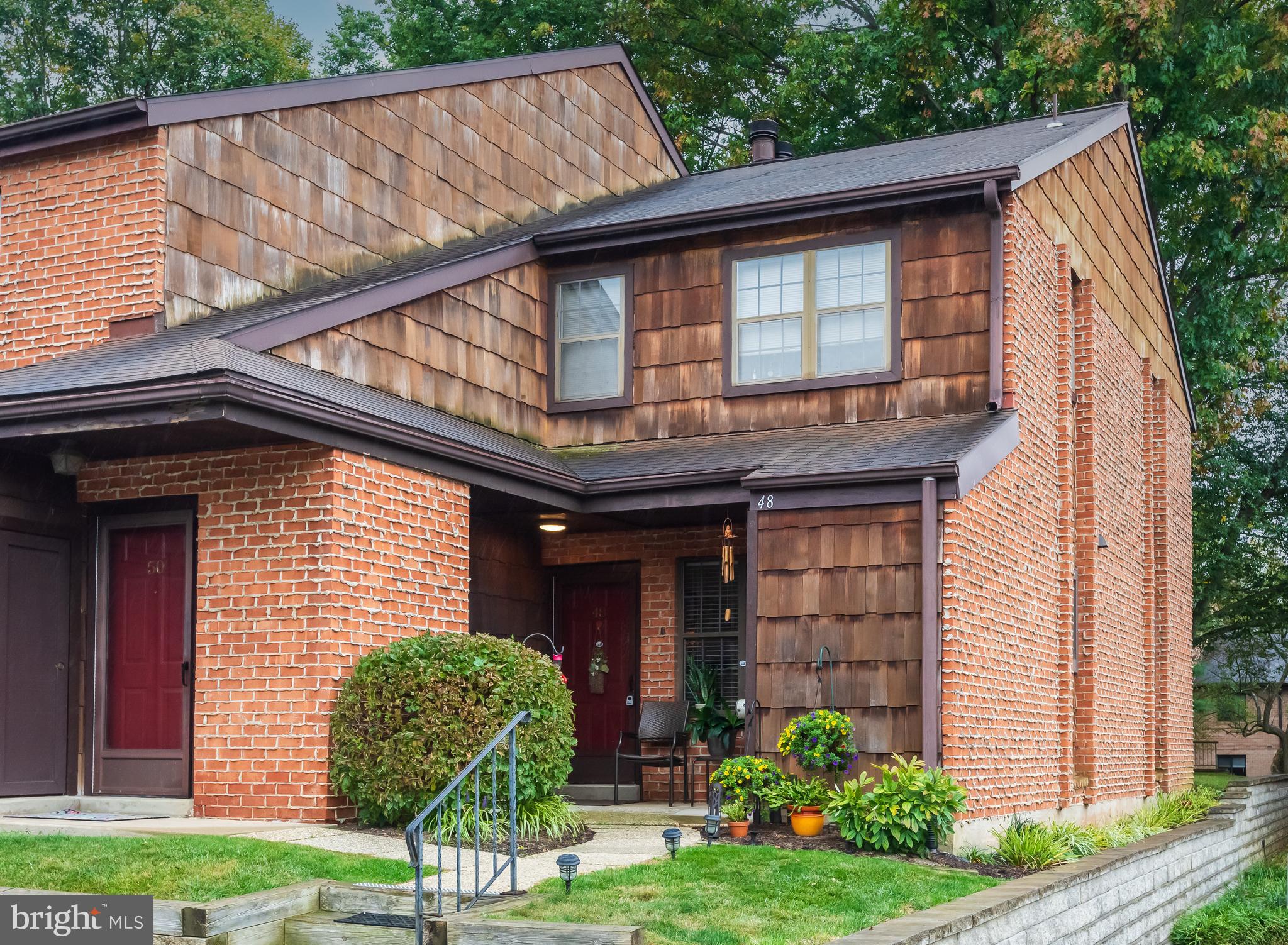 Welcome to 48 Rittenhouse Court, a beautifully maintained two-bedroom, two-bath home in the highly sought-after Embassy Court II community of Chesterbrook. This terrific first floor, end unit home is located in the top-ranked Tredyffrin-Easttown School District and has been very well maintained by the current owner. A charming covered front porch leads to the formal entrance hall which opens to a spacious open concept living and dining area featuring gleaming hardwood floors, recessed track lighting, and a handsome Colonial-style fireplace mantel. Sliding glass doors open to the rear patio. The eat-in kitchen offers raised-panel cabinetry, generous counter space, a pantry, and hardwood floors. The sumptuous owner’s suite includes a deep walk-in closet and a full bath with a tiled stall shower. A second bedroom/home office features patio access and a double closet, with a full hall bath perfectly positioned for both guests and the second bedroom. The covered rear patio overlooking community open space is the ideal spot for relaxing, entertaining, grilling, or dining al fresco. A large walk-in closet off the entrance hall plus two outdoor storage closets offer tremendous storage space. There are two assigned parking spaces right outside the front door. Hardwood floors, tasteful updates, ample closet space, and abundant natural light all combine to make 48 Rittenhouse Court a very special place to call home. Close to the Chesterbrook and Gateway Shopping Centers, the King of Prussia Town Center and the shops, restaurants, and trains of the Main Line. Just a short stroll to the trails of fabulous Wilson Farm Park and Valley Forge National Park. A wonderful home in a prime location. This is the one…welcome home!