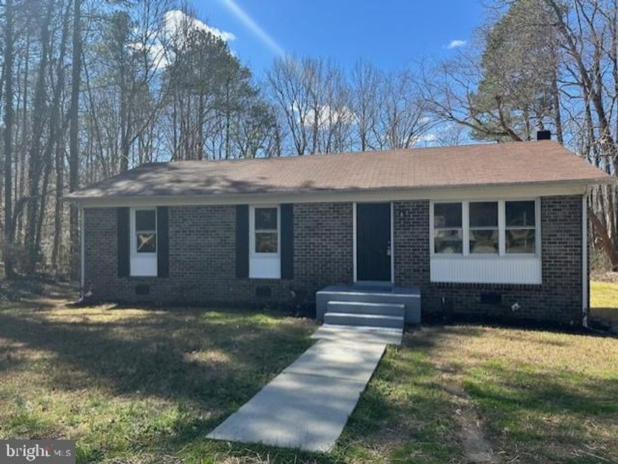 NO HOA! Private yet easy access to Route 1 and I-95 on 1+ acre just south of Carmel Church. New LVP flooring in the main living areas, baths, and laundry room. Kitchen has new white cabinets, countertops recessed lights, and stainless-steel appliances. High end vanity with marble top along with new fiberglass tub in the hall bath.  Bedrooms have neutral carpet, 6 panel doors, and custom trim.  The large laundry room has counterspace and cabinet for storage. New LED light fixtures and plenty of windows throughout provide plenty of light inside. Large deck overlooks private back yard.