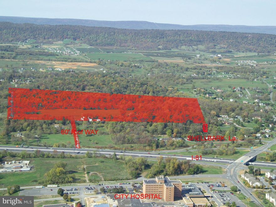 53+- acres +/- set back and entirely visible from I-81. Site is situated off of Exit 14, I-81 interchange;   University of WV  Hospital Exit and Dry Run Road Exit.  It is across I-81 from the University of WV hospital. Current access is via Shellbark Lane to Cabana Lane  (60' wide access point), other access possible. NO ZONING, great property for residential, commercial or mixed use. Lots of recent development in this area notably big Proctor & Gamble manufacturing plant, multiple warehouse facilities (Amazon in Winchester). Adjacent to residential developments. Also several large residential  developments within 3 miles. Site is about 11 miles from the I-70/I-81 interchange in Maryland.  Easy access to down town Martinsburg, DC Commuter train, great commuter location.  

Property consists of three adjacent parcels. Additional lots 3.74 Acres Summit Drive priced at $137,500.
Lot 5 Shellbark, priced at $72,000.

This site has 100 feet of direct frontage on Shellbark Lane which is sufficient for utilization as an access point for intensive development of the site. An adjacent lot along Shellbark Lane which is also offered provides a second area of road frontage and a second access point for significant development. The property previously secured Sketch Plat approval  for intensive development which  demonstrates the residential development potential of this site. 
Appraisal available.
 PUBLIC WATER AND SEWER LINES AT PROPERTY BOUNDARY.