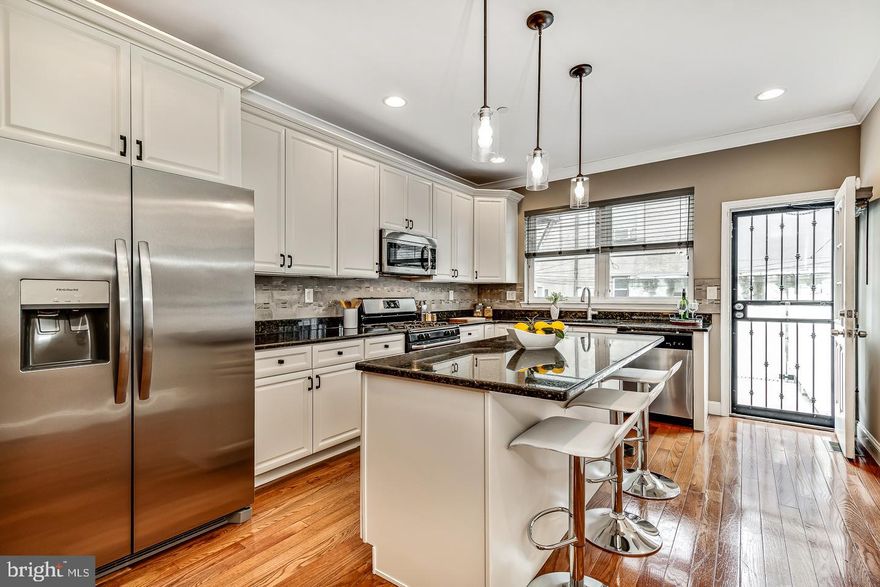 Make 1505 Dickinson your next home and you will never want to move again! There is absolutely no reason to.... This home has everything today's buyer is looking for, AND MORE! Nestled in the heart of Newbold, on a tree lined street that is one block west of Passyunk Square, this exceptional three-story townhome seamlessly blends impeccable workmanship with timeless traditional beauty. The Southern facing residence is move in ready. Boasting thoughtful finishes and an abundance of natural light throughout. The open concept layout showcases hardwood flooring and effortlessly transitions from a spacious double living room to a dining area, and then to the chef's kitchen. The flow is seamless for entertaining. Offering the new owner stainless steel appliances, a GAS range, granite countertops, 42''custom cabinets, a tastefully appointed stone and metal backsplash, a central kitchen island with a solid slab of granite that comfortably seats 3 for breakfast or can be used as a buffet. The 76-foot lot length is clearly evident when you step outside the kitchen to enjoy the rear patio. Perfect for dining “Al fresco", private and secure for pets and children. This space is fantastic.  The cement pavement patio was just coated in epoxy for durability and carries a 15-year transferable warranty as well. Venture to the second floor, where you will find two generously sized bedrooms. Each with cavernous closet space.  The full hall bathroom offers a double sink vanity with a granite countertop, a fully tiled bath surround and 
the luxury of a discreet commode room. The third floor is the sumptuous, and well-appointed primary suite.  Enter the enormous bedchamber from stately double doors and be prepared to be OVERWHELMED by the sheer volume of space and the height of the vaulted ceiling. Take note of the custom walk-in closet that generously gives one the storage and hanging space the equivalent of 
an entire hallway! This is unmatchable! The primary bath has two entrances. One through the closet, and one from the hallway. This thoughtful attention to detail, allows one to get ready for the day, and leave the floor without waking the fellow sleeper. Brilliant! The Spa-like bathroom retreat welcomes the user with soothing and luxurious finishes, a double vanity with granite countertops, a HUGE and well-appointed shower, a linen alcove and a linear window that strategically floods the bathroom with natural light without taking any wall space away. PERFECT for getting ready. Then onward to the 2nd outdoor space, The massive roof deck. Showcasing the best views of the Center City skyline possible. Other noteworthy mentionables are the gigantic lower-level FLEX space that can be a theater, family room, gym, office or anything you desire. The space is all there to be used as you wish, and is complemented by a powder bath, electric fireplace, laundry room and endless storage. Additionally this home offers a secure alley access for added convenience. Updated mechanicals, new AC compressor in 2023, sprinkler system, and NEST thermostat. All of  this is situated just one block off Broad Street and the underground subway line. Live a totally walkable urban lifestyle, there is no reason to have a car. Steps away from Passyunk Square and its desirable boutiques, restaurants and cafes. Offering a vibrant lifestyle with easy access to transportation and local amenities. One can walk or bike everywhere. Also right around the corner from
the BEST local eateries like Batter and Crumbs, Rosario’s pizzeria, Hive, Hardena more than we can mention here. Bodegas for a quick shop, Sprouts and Acme for the larger shopping. 2 short blocks walk to Columbus Square and dog park. Don't miss the opportunity to own this wonderful home where luxury, craftsmanship, and convenience all converge to create a truly exceptional living experience in a great neighborhood! This home qualifies for a Grant to buyers through Prosperity Mortgage Home Assist.