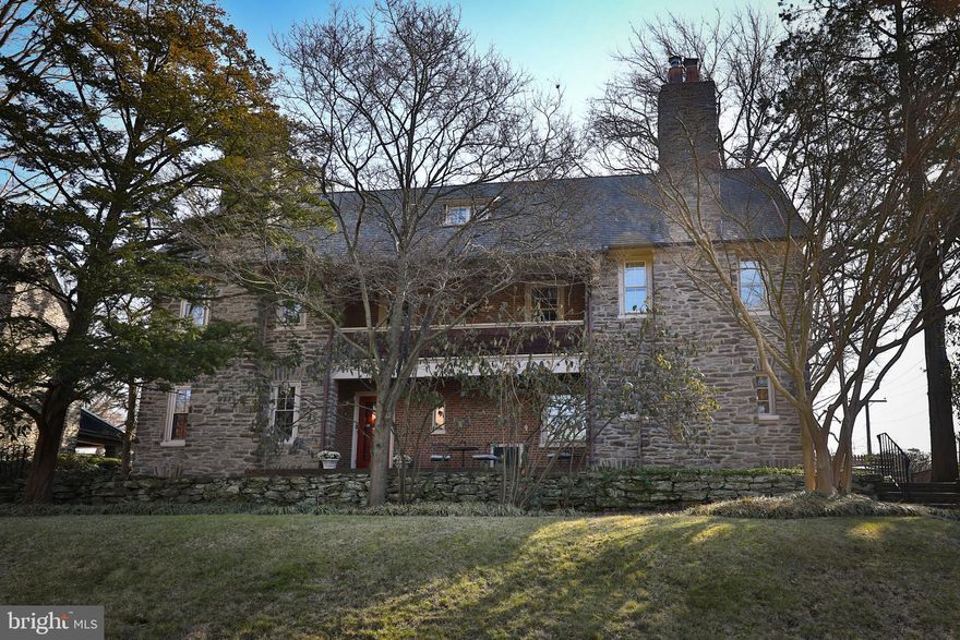 This lovely home has been turning heads since it was first built in the early 1900’s. It graced the cover of American Country Homes magazine in 1912 and was featured on the Historic Gowen Estate tour in 1997. Nationally noted architect Charles Z. Klauder designed the house and became the first of only three owners since that time.  The present owners have lived lived here for 52 years, proving that good things are indeed worth holding onto. Perfectly sized to meet all of your needs without feeling overwhelming, this impeccably maintained property displays a host of updated features as well as much original detail. A relocated kitchen with newer Pella windows, tiled floors, radiant heat, custom cabinetry, quartz countertops  and high-end stainless steel appliances anchors one end of the home. A bar sink makes for easy entertaining and the built-in desk helps with daily organization. The adjacent formal dining room boasts a beautiful built-in display cupboard and looks out over a deep back yard. French doors open to the brick back porch. The large living room has lovely original paneling and features a picture-perfect inglenook. A dreary winter’s day will feel simply magical when you are curled up by the fireplace (converted to gas) in one of the built-in bench seats. Upstairs, on the second floor you will find the spacious primary bedroom with Marvin replacement windows. Two huge walk-in closets allow for plenty of storage- one (8X8) is even large enough to be nursery or small office. The ensuite bathroom features a marble floor, shower/tub, and heated towel racks. There are two additional bedrooms on this level, one with built-in bookshelves that is currently used as a den. Working from home is  a breeze in the office for two, with custom desks built in. A freshly painted hall bath features subway tile and a large shower as well as a spacious linen closet. The third floor offers two additional bedrooms, a sweet hall bath with claw foot tub, and plenty of storage. Hardwood floors run throughout the first two levels; painted pine on the third. You will be amazed by the storage space in the basement where the owners have installed an array of free-standing and built-in shelves, bookcases, and containers. There is also a large laundry room (washer and dryer included), small workshop area, and access to an attached garage that opens onto Crittenden Street. The backyard is a thing of year-round beauty.  An expansive lawn is the perfect spot for a hammock, a picnic, or a soccer game, and some half dozen areas are devoted to flowers (annuals and perennials). Mature trees (white pine, cedar, Japanese maple, holly, crepe myrtle, and sweetgum) and plants (mountain laurel, cherry laurel and azaleas) line the perimeter. 
Warm and cozy in the winter, and cooled by two-zone air conditioning in the summer (2nd and 3rd floors new in 2021), this is truly a house for all seasons. Current owners have removed all the knob and tube wiring in addition to the numerous upgrades throughout the years.  Located on tree-lined Gowen Ave, once named The Prettiest Street in Mt. Airy, just 0.4 miles from the Mt. Airy train station and less than a mile from numerous restaurants, coffee houses, a fitness center and an award-winning classical theatre. Showings begin on Friday, Feb 10.