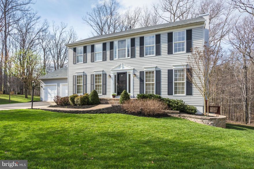 The curb appeal drives you in and you won't be disappointed when touring this home inside and out. Lovely kitchen and family room with fireplace backing to large two tiered deck overlooking nice yard and beautiful woods.Four bedrooms up. Huge master suite with updated walk in closet and huge garden bath and shower. Lower level features 5th bedroom, full bath, walkout and rec room. Easy commute!