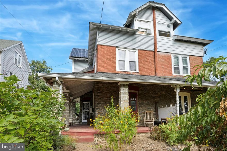Step into timeless charm with this beautifully preserved and thoughtfully updated Victorian twin nestled in Historic Germantown, Philadelphia. Boasting 6 spacious bedrooms, 2 full bathrooms, and a generous mix of original character and modern upgrades, this home offers a unique blend of charm, comfort, and versatility. As you approach, park in your multi-vehicle driveway and you're welcomed by a grand wraparound porch—perfect for morning coffee, evening gatherings, or the perfect dinner ambiance. Inside, the home features wood floors, high ceilings, and abundant natural light throughout. Enter through the front door into the foyer. Go right, into the living room, with a wood-burning stove adding warmth and coziness to the living space, ideal for Philly winters and intimate nights in. Open the French doors to go onto the porch for a summer sit. Head to the renovated kitchen, which is a chef's dream, complete with updated appliances, induction cooktop, cabinetry, and plenty of counter space for creating and entertaining. Continue back to the back mudroom and newly renovated full bathroom. Go down to the basement to find laundry area, plenty of storage space, an extra toilet, Biltco doors that open into the driveway, and an enclosed room that could be your workshop or extra storage. Head upstairs to the 2nd floor to find 3 bedrooms. The front and rear bedrooms are both large and could be considered the primary bedroom - both have a great view as well. The front bedroom looks over the front garden. The rear bedroom looks over the rear garden, yard and cottage. The 2nd floor bathroom has been recently renovated with a great blend of a historic and modern aesthetic. Walk up to the 3rd floor and find another 3 bedrooms. All bedrooms are spacious and there is great storage at 423 E. High St as well. Head to the backyard and find a one of a kind bonus laying beyond the main house—a 650 sq ft insulated cottage sits nestled just right, offering incredible flexibility as a guest suite, artist’s studio, home office, or other creative use. It features a wood burning stove, huge double paned windows and high ceilings, creating a feeling of cozy yet private luxury. The large yard is perfect for gardening, outdoor dining, or just enjoying a quiet evening. Speaking of gardening, the soil has been tested and is extremely nutrient rich, the front garden gets full sun and is perfect for growing vegetables: tomatoes, peppers, squash, beans, herbs, and more, with arched trellis to support. There are perennial herbs and flowers growing along both sides of both yards. Don't forget the fruit trees: peach, Juneberry, fig, elderberry, cherry, and grapes. Your very own Germantown homestead awaits! Additionally, big updates include solar panels (paid off at settlement), newer roof (2019), updated electric, renovated bathrooms and kitchen with radiant floors, new siding, and so much more. With all its amenities and easy access to public transit, shops, parks, and all that Germantown and the NW has to offer, this property is a rare find ready to become home.
