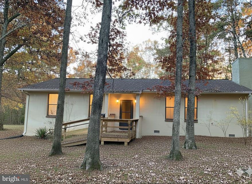 Large Rambler with 5 ACRES Lovely LAND, Level and Privacy!   Featuring appx  1479 SQ FT! Country Kitchen!  Large Step down family room with brick fireplace &  2 wood decorative wood boxes.  TALL CEILINGS! 3 ceiling fans, w/w carpeting, washer & dryer convey. Primary bedroom with double closet/adjoined to front coat closet.  2nd bedroom could use closet on other side.  Large full bath and wide hallway.  Roof, replaced 2017.  Outbuilding/Shed conveys.  Sold  in "as is" condition.  Well constructed home...a Diamond in the rough, bring your vision & ideas.  Zoning A-3.