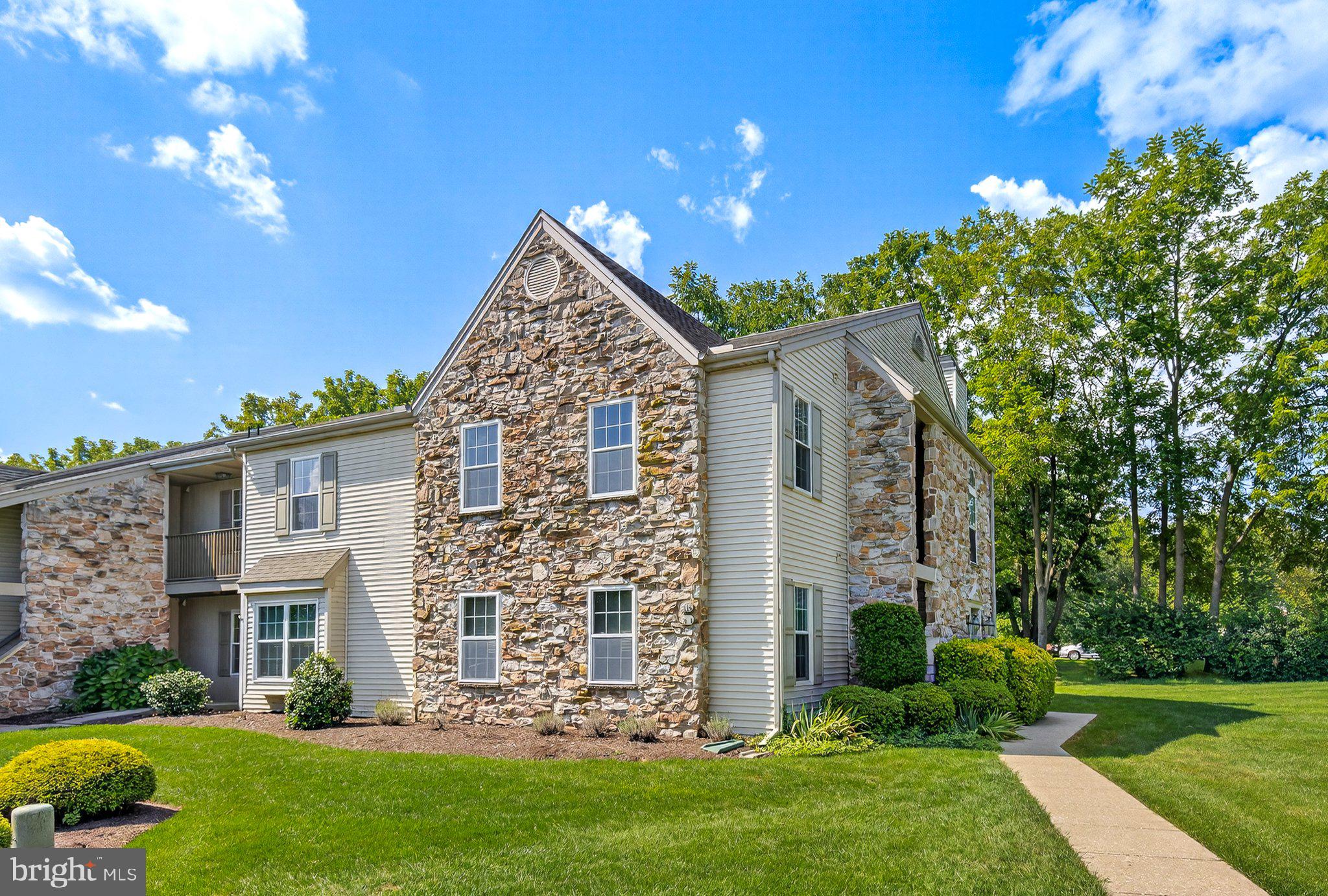 Discover the perfect blend of comfort and convenience in this updated 2nd-level end unit. The inviting living room features recessed lighting and a cozy fireplace, flowing seamlessly into a formal dining area and a modern kitchen with upgraded counters and stainless steel appliances. A dedicated laundry room adds everyday convenience. The spacious primary suite includes a private bath, while two additional bedrooms and a hall bath provide plenty of room for guests or family. Step outside to a covered balcony and take in the scenic views of the surrounding area—an ideal spot to relax and unwind. Parking is effortless with ample lot spaces available. This move-in ready condo offers both style and functionality—schedule your showing today!