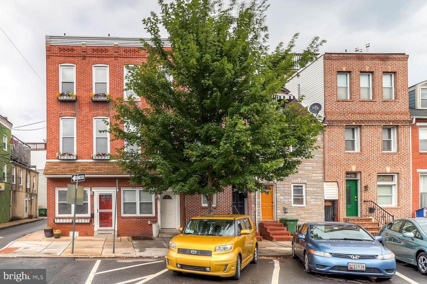Bright and sunny end of group  centrally located on Billie Holiday Way in Historic Fells Point.  3BR/2BA  home with PARKING PAD! Updated kitchen and bathrooms stainless appliances, hardwood floors, exposed brick, front loading washer and dryer.   2nd floor bonus room could  be used as a den/office/playroom.  Two-tier rooftop deck with incredible  360 panoramic views of water, skyline and harbor. Dry cellar with outside entrance for  lots of storage. Pictures show home empty  and walls are now a slightly different color.  Deck has been painted. Pets on a case by case basis .