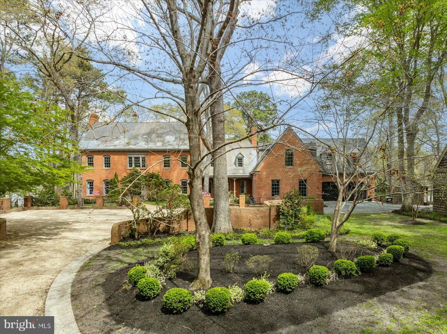 Nestled on a secluded 2-acre lot overlooking Tony Tank Lake, this stately 6905 sq, ft. all brick residence melds master craftsmanship with the perfect private location. Exuding timeless appeal and offering a host of inviting spaces for day-to-day living and entertaining, this 6 bedroom, 5 full bath / 2 half bath home features 9 ft ceilings on the 1st floor, extensive moldings, hardwood flooring, 3 fireplaces, a completely renovated gourmet kitchen w/ custom cabinetry, 2 islands, walk-in pantry and Wolf/Subzero appliances, a recent addition offering a deluxe primary bedroom retreat that includes a dramatic 11 ft ceiling, gas fireplace, and custom metal arched closet doors, as well as a luxurious bathroom w/ Carrara marble, heated floors, steam shower, and 2 custom reed oak vanities. Other features of the home include a exquisite winding staircase, formal living room and dining room, spacious family room, mud room w/ brick floor and cubbies, a laundry room w/ ample cabinetry, a 1st floor bedroom w/ private bath, a back staircase leading to the 2nd floor landing off the rec/family room and primary suite, and a walk-up attic. The exterior offers a private driveway to the stately front courtyard, an attached 3-car garage and detached 2-car garage w/ walk-up storage, a brick waterfront patio off the kitchen and family room, a lakeside flagstone patio, a private pier, a heated concrete pool, a pool shed, in-ground irrigation, and tranquil waterfront views all around the property. Septic approved for 8 full-time residents and recently inspected.