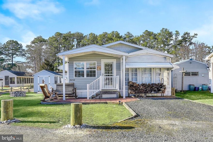 This delightful property presents a turnkey move-in opportunity w/ its inviting ambiance & convenient amenities. Nestled on Chincoteague Island, this cozy abode features a 1989 Palmaire mobile home w/ a tasteful addition, offering a total of 1 bdr & 1 bath. Step inside to discover an immaculate interior boasting an open floorplan that accentuates spacious, bright, & airy rooms—ideal for both relaxation & entertaining guests. The layout seamlessly flows from a generously sized living room w/ a dining area to an inviting eat-in kitchen & a cozy sitting area. The spacious bedroom offers ample built-in storage areas, adding to the home's functionality and charm. Outside, the property offers additional delights w/ a covered front porch accompanied by a patio & firepit, & 120 square foot shed.