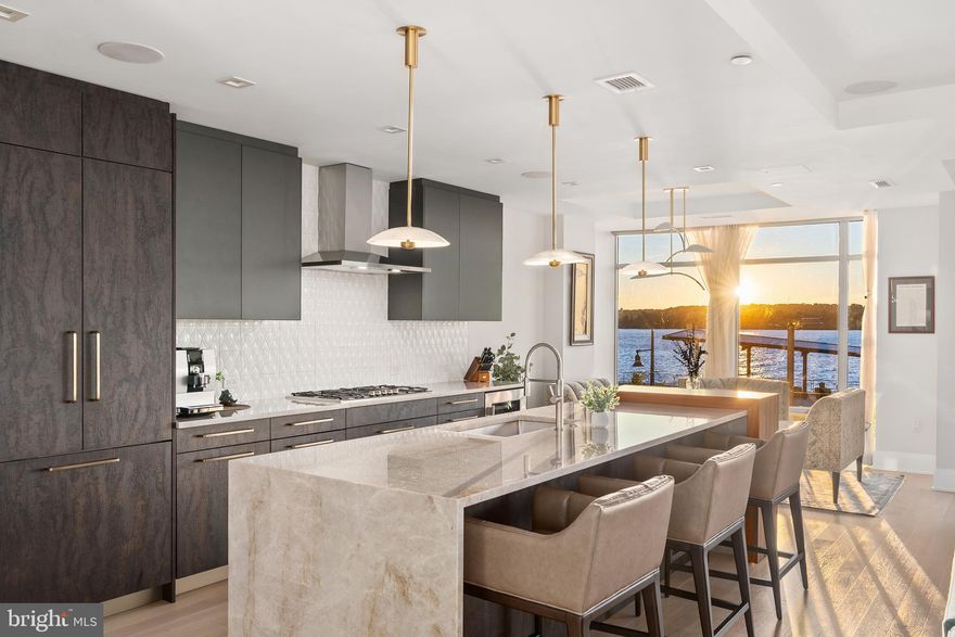 Luxurious riverfront condominium located in Robinson Landing in Old Town Alexandria. This 2-bedroom PLUS den, 2.5 bath unit has panoramic views of the Potomac River. Wake up to beautiful sunrises every morning and enjoy a warm cup of coffee from the luxurious kitchen featuring Snaidero cabinetry, top-of-the-line appliances and quartz center island. Outfitted with the best finishes throughout, spacious living areas, floor-to-ceiling windows with remote-controlled blinds, 2 garage spaces and storage unit. Located along Old Town's vibrant waterfront and just 2 blocks to the shops and restaurants of King Street, Robinson Landing offers concierge service, 24-hour on-site staff, fitness center, yoga studio, pet grooming spa, bicycle storage and workshop, elegant lobby, game room and resident lounge with Potomac River views. Work out in the building's gym while looking over the Potomac River, then grab a coffee at the one of the restaurants located on the promenade in front of the building. Take a stroll along the waterfront, dine on the pier, shop at the Farmers Market or enjoy a multitude of activities available in Old Town. Convenient to Reagan National Airport, Amazon's HQ2, Capitol Hill, the White House and all metro D.C. has to offer.