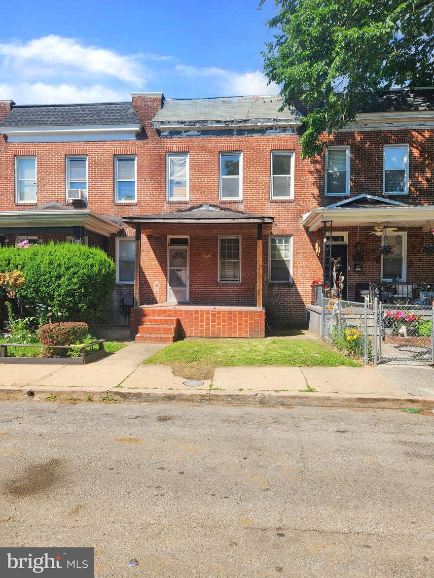 Spacious three bedroom brick townhome in need of restoration to its former beauty. Large finished basement and great backyard.
