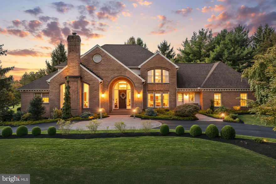 Nestled within the prestigious Wyndham Hills community, discover this stunning, all-brick contemporary home, custom-built by EG Stoltzfus. Every room has been thoughtfully designed, offering an unparalleled blend of luxury, comfort, and timeless elegance.
Spanning over 5,500 square feet, this gorgeous contemporary home offers an inviting atmosphere with six spacious bedrooms and four and a half elegantly appointed bathrooms. Throughout the home, you'll find custom details that exude character and charm, including beautiful composite wood floors, crisp crown moldings, and refined chair railings.
The heart of the home is the gourmet kitchen, featuring upgraded countertops, a large center island, and a bright dining area, perfect for both everyday meals and entertaining. Adjacent is the spacious 2 story family room, anchored by a cozy gas fireplace and featuring an alcove with a wet bar for seamless entertaining. The formal dining room boasts unique beam accents, adding a touch of architectural distinction.
Experience true first-floor living in the luxurious primary suite, a private sanctuary complete with a soaking tub and a walk-in shower, providing a spa-like experience at home. The second floor offers exceptional space with four additional generous bedrooms, two full bathrooms, and access to a huge attic for abundant storage.
This home offers incredible versatility with a finished lower level, designed for ultimate recreation and comfort. It features a spacious rec room, a second fully equipped wet bar, an exercise area, and is completed by an additional bedroom and a full bath.
Situated on a generous 0.77-acre lot, the exterior is just as impressive as the interior, featuring extensive, professionally maintained landscaping and sophisticated hardscape, including a large 12x25 brick patio perfect for outdoor gatherings.
Practical luxury is found in the three-car side-entry garage and the convenient circular driveway, offering ample parking and curb appeal. Located in York Suburban School District, just minutes from Wellspan York Hospital, Apple Hill and two country clubs, you couldn't ask for a better location.