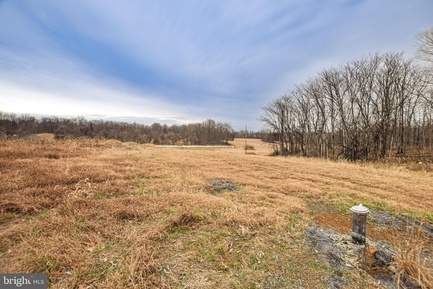 Don't miss out on this rare opportunity to own nearly 8 UNRESTRICTED acres in Shepherdstown. Sweeping sunset views make this a perfect location to lay down roots and build your forever home.
Build with confidence as major groundwork is already complete. Perc-approved for a 4 bedroom house with well already in place. Experience true flexibility to build your dream home with NO HOA. Although the property itself does not have an HOA, it is situated off of a state maintained road making it accessible but private. Lot is conveniently located close to Route 9, ideal for commuters. If country living with access to modern conveniences is what you seek, then look no further than this picturesque property.