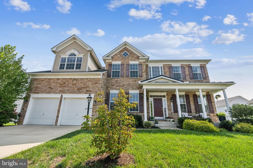 Freshly Painted and NEW Carpet just installeed!!!! Stunning stone-front Princeton-style colonial offering exceptional space, thoughtful upgrades, and an open-concept layout designed for both everyday living and entertaining. The heart of the home is a chef-inspired gourmet kitchen with granite countertops, oversized island, and stainless steel appliances, flowing seamlessly into a sunlit morning room and expansive family room with dramatic two-story ceilings.

The main level is incredibly versatile, featuring a full bedroom and bathroom plus two additional flex rooms ideal for a home office, playroom, guest space, or multigenerational living. Upstairs, you’ll find four generously sized bedrooms, including a luxurious primary suite with a sitting area, two walk-in closets, and a spa-style bath with a double walk-in shower.

The fully finished walk-out basement offers an oversized recreation room with wet bar—perfect for entertaining—along with a finished bonus room with built-in shelving and two large storage rooms. Additional attic storage adds even more functionality. Outside, enjoy a fully fenced backyard with patio and shed, plus a welcoming front porch—making this the only home in the HOA community to offer both a front porch and a back patio.

Located in a private, amenity-rich community with playgrounds and tennis courts, this home offers strong resale value and an unbeatable commuter-friendly location, just minutes to Washington, DC, Old Town Alexandria, National Harbor, and the newly announced Sphere venue. A rare combination of space, flexibility, and convenience in a highly desirable setting.