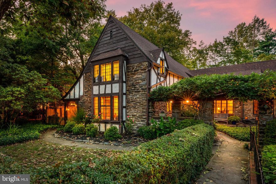 Rare treasure. Welcome to 419 Arthur Round Table in Lower Merion’s English Village. Inspired by the hamlet’s found throughout Briain’s countryside, discover an unparalleled combination of historic charm, exquisite detail, walkability and quaint private neighborhood. This quintessential tutor boasts pristine and handsome curb appeal, which is only matched by the architectural detail and charm on the interior. Premier central location, steps to Lower Merion High School, walkable to Suburban Square, Ardmore and Wynnewood train stations. Walk up the flagstone path to a gracious courtyard entry with manicured gardens on both sides. Continue under the wisteria trellis and approach the elegant arched stone entry. Open the original door of this 1925 masterpiece and you are welcomed by a mercer tile foyer, which opens to a sun drenched dining room with lead glass windows and french doors to an enchanting backyard. A large living room with exposed beams, rich random width wood floors, stone fireplace, oversized window seat with southwest facing light, lead casement windows and french doors to a covered flagstone porch. Beyond the dining room, a bright kitchen with exposed brick and sunny window overlooking the yard boasts another arched door leading to the fenced yard with flagstone terrace and multiple seating areas. The first floor is finished by a cozy family room off the kitchen with parquet floors and completed with a full bath. Random width antique hardwood floors, exposed beams, glorious light, arched doorways, french doors, leaded casement windows, and deed window seats are just some of the timeless finishes that make this home exquisite at every turn. A wide open staircase with fine detail leads to the wide, bright hallways that connect the four bed, two full bath second floor.  The sizable master suite gets glorious light as it faces another beautiful window seat with southwest exposure, ample storage and ensuite master bathroom. The second bedroom off the master is generously sized. Two additional bedrooms share an updated jack and jill bathroom. The basement allows for additional storage. Nestled privately in an extremely central location, this home is a commuters dream close to major roadways and two train stations. Sought after Lower Merion School District.