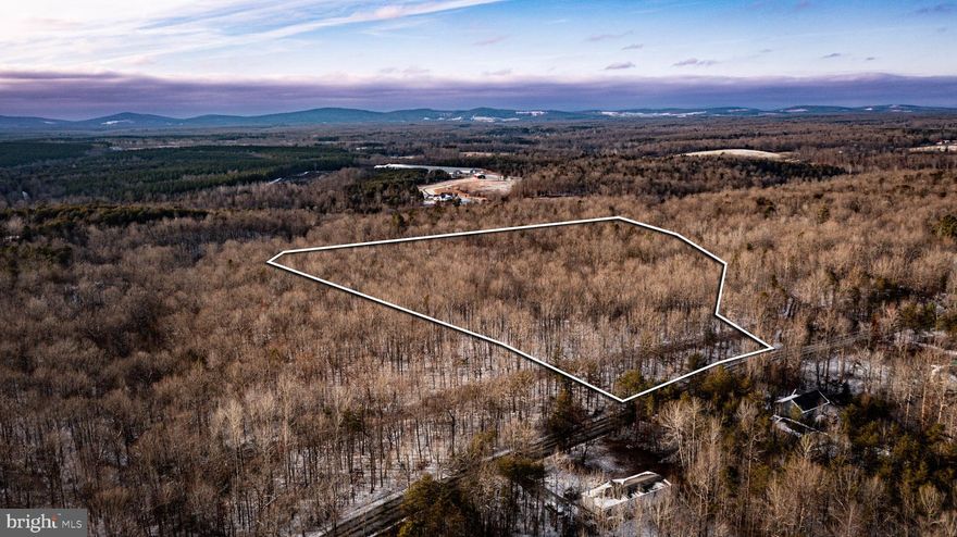 Nestled just west of Lake Anna, this 10± acre tract offers the perfect blend of privacy, natural beauty, and convenience. Gently rolling and filled with towering hardwoods, the property provides an ideal setting for your dream home, weekend retreat, or investment opportunity.

With no HOA or restrictive covenants, you have the freedom to build exactly what you envision. A survey is on record, and the lot has previously been approved for a 3-bedroom conventional septic system, with a proposed homesite and drainfield marked on a 2004 survey—making the path to building smoother.

Power lines run along the front portion of the property, providing easy access for utilities. Located just minutes from Orange and Gordonsville, and with quick access to James Madison Highway, you’re never far from Charlottesville or the conveniences of town.