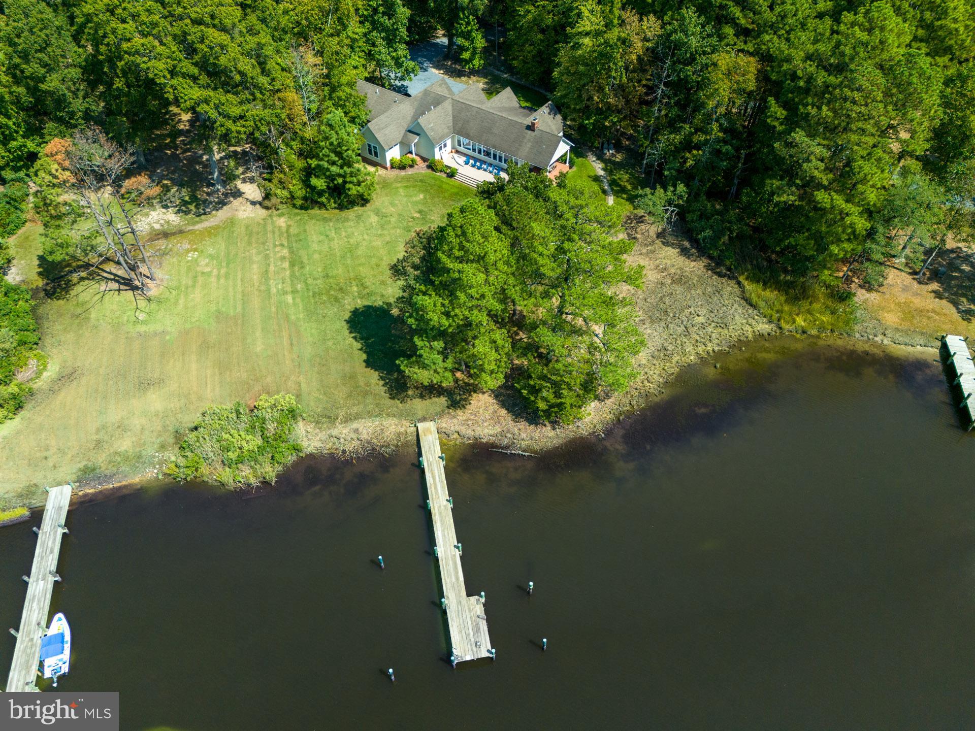 The Perfect Waterfront Get-Away. This one-story, 4 bedrooms and 2 full baths home epitomizes Eastern Shore relaxation. This turn-key Home was built in 1998 and has been tastefully updated. Features include an open floor plan with vaulted ceilings in the Living/Dining area and a wall of glass overlooking Leeds Creek. Private waterside Primary Suite with separate walk-in closet, full bath with double vanity, new flooring throughout, 9’ ceilings, recessed lighting, kitchen with SS appliances, painted cabinets, gas cooktop, double oven, and island, Tankless HWH, updated heating and AC units. Outside covered porch offering extensive water views, and a composite deck stretching across the back of the house, attached oversized 2-car garage, public sewer. Quality materials/craftsmanship throughout. Property has a pier with 3.5’+/- MLW, Western Exposure with incredible Sunsets! Close to St. Michaels and Historic Easton.