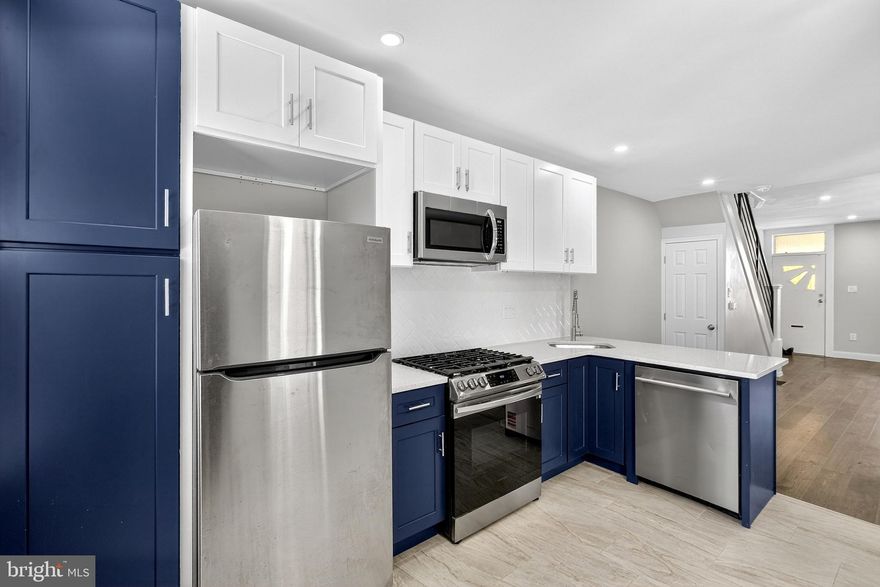 Welcome to your next home located on 221 N. Hobart St - a well-updated interior rowhome on a neighborly block where pride of ownership shows. This 3 bedroom, 1 bath home offers a smart layout with modern finishes throughout.

Inside, you’ll find new wood floors, recessed lighting, modern railings, and a lovely two-toned kitchen featuring quartz countertops, solid wood soft-close cabinetry, a floor-to-ceiling pantry, and a ceramic tile backsplash. The bathroom is finished with a contemporary backlit mirror. Additional upgrades include new central air and washer/dryer hookups in the polished unfinished basement - which is also a great opportunity to add value if so desired.

Enjoy outdoor space with a spacious front porch and a large backyard—ideal for relaxing, entertaining, or gardening.  This is a solid opportunity for buyers seeking comfort, updates, and community.