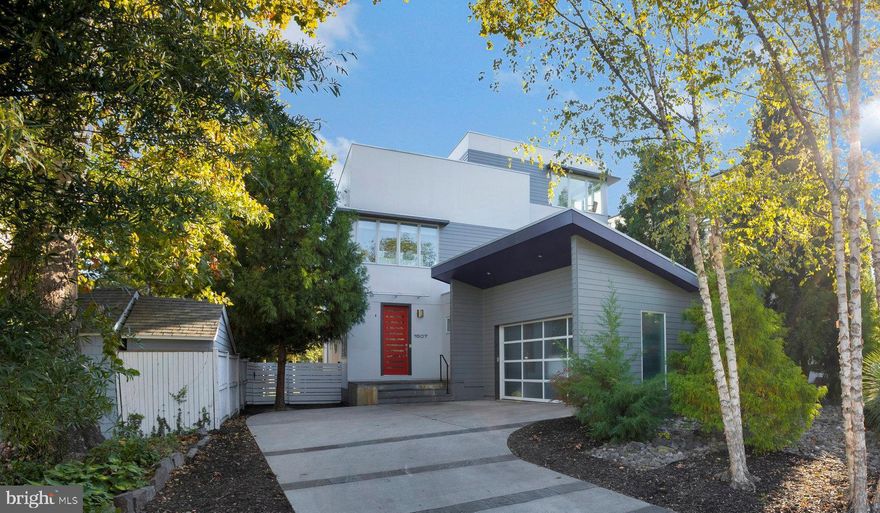 Prime Location Just 2 Blocks from Downtown Clarendon!  This beautiful contemporary home boasts 5 Bedrooms, 4 1/2 Baths, a dramatic, open floor plan with floor to ceiling windows everywhere, open-cable staircases,  10-foot main level ceilings, private, super contemporary office, curved walls and 3rd level loft area with private roof-top deck.  Custom built in 2000 by Sagatov Associates, this home features 3973 finished square feet above grade and an additional 1479 finished below grade.   featuring the 5th bedroom, full bathroom and very large rec room which is currently used as a fitness gym.  Parking is not a problem here with a spacious side load, 2-car garage and space for as many as 4 additional cars.  Meticulously landscaped in the front, the rear of the home is fenced, gated and enjoys a beautiful artificial turf surface that is perfect for your kids and pets!  Walk to Metro, your favorite restaurants, and so much more!  It's a commuters dream with easy access to downtown WDC, the Pentagon, DCA , Crystal City and Bethesda, Maryland.