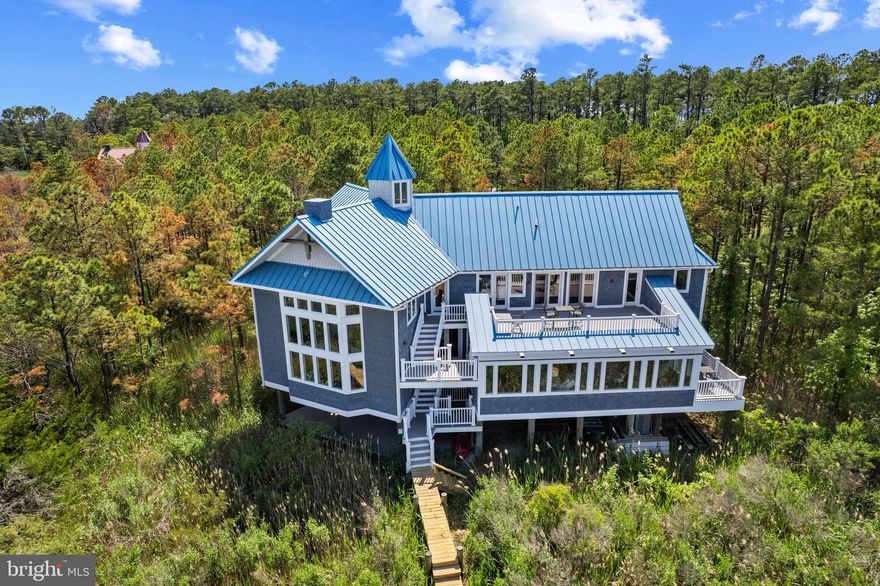 Welcome to 5419 Ragged Point Road — Closer than you think to D.C., Baltimore, and Ocean City, a striking contemporary waterfront estate set on 11.88 private acres with an incredible 1,500 feet of frontage along serene Brooks Creek. Designed for those who appreciate the best of Eastern Shore living, this 4-bedroom, 2 full/3 half bath custom home, built in 2007, offers exceptional craftsmanship and luxury throughout with all the designer furnishings included. 

The gourmet kitchen is a chef’s dream, featuring marble countertops and top-tier appliances, including Wolf, Bosch, and Sub-Zero. The elegant primary suite offers a spa-like retreat with a soaking tub and separate shower. Expansive living spaces open to multiple balconies and decks, each perfectly positioned to capture breathtaking water views.

Outdoor amenities include a private pier with approximately 3 feet MLW (mean low water), complete with water, electric, and a 12,000 lb boat lift — ideal for boating and fishing enthusiasts. For hunters, a duck blind on the property and abundant wildlife make this a rare hunting paradise.

Whether you are savoring the sunrise over the creek, entertaining guests, or exploring the surrounding natural beauty, this extraordinary property delivers a lifestyle of unmatched tranquility and recreation.