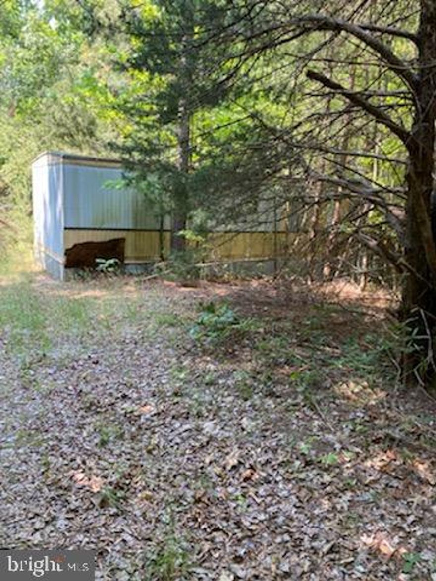 BACK ON THE MARKET: Parcels: Tax Map 101-A-2A & 101-A-3 (GIS Mapping Photos Above) are being listed for sale as a package deal 9.8+ acres of rural wooded land. 
***Buyer be sure to walk the property prior to submitting an offer***

Property would be more suitable for one SFR. Zoned rural preservation with many uses commercial or residential. Perfect for Agricultural use, farm, livestock or horse pasture, greenhouse, etc. or just build your dream home. Perfect location on Signboard Road between Ruther Glen and Doswell. Just minutes from I-95 (kings Dominion). Signboard Road is Red Hot!
* There is a burial plot on the property. Easement for family to maintain burial space separate from main right of Way from Road frontage on Signboard Road. Lots may be Subdivided. Agent/buyer to confirm with Caroline County planning Office .
No Soil Work done. Survey has been completed in recent months. Make your highest and best offer today.